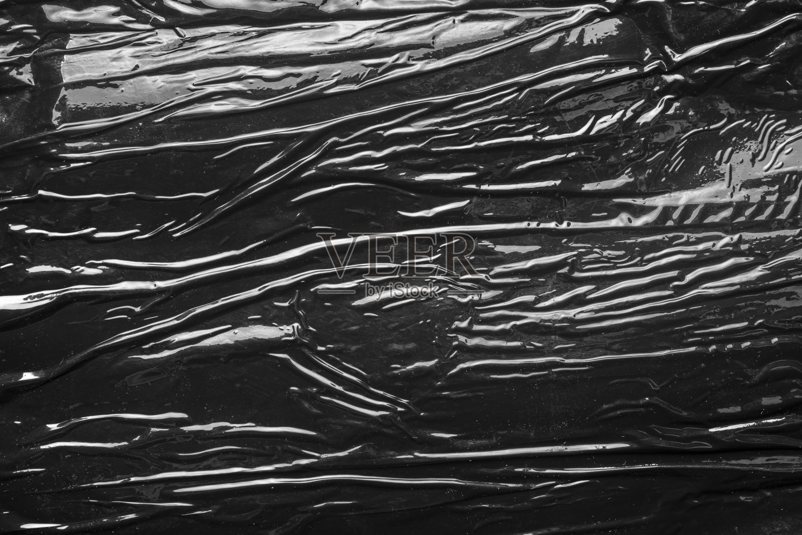 质地黑色聚乙烯纸。照片摄影图片