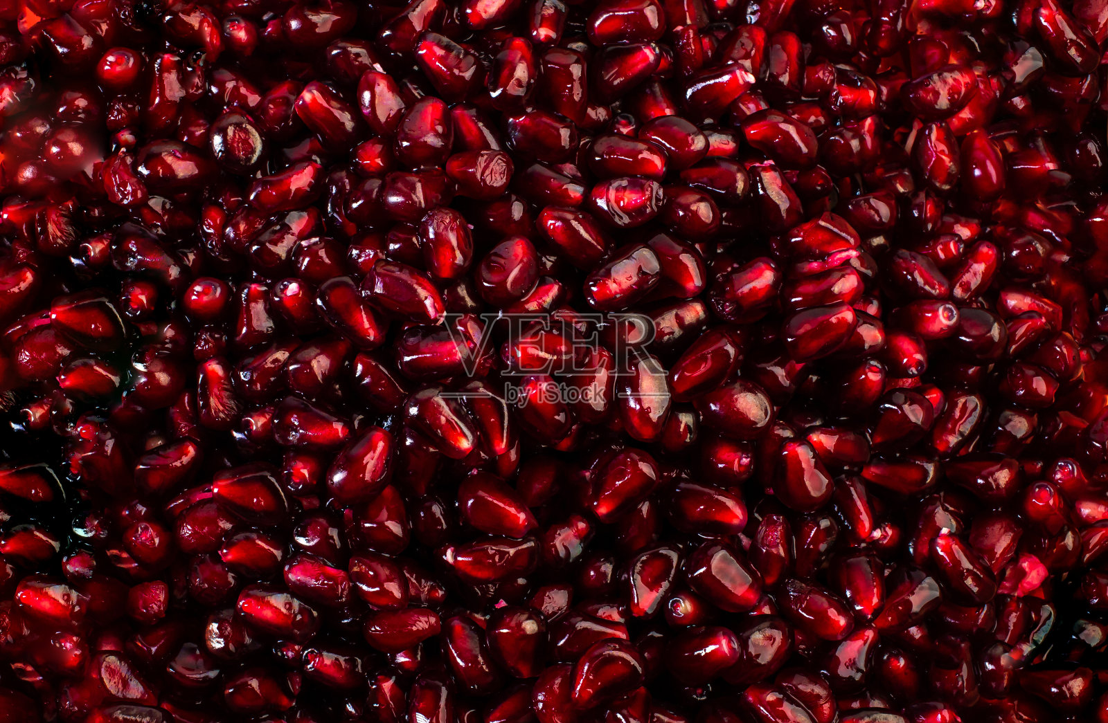 美味成熟红石榴籽成熟多汁背景纹理图案。照片摄影图片