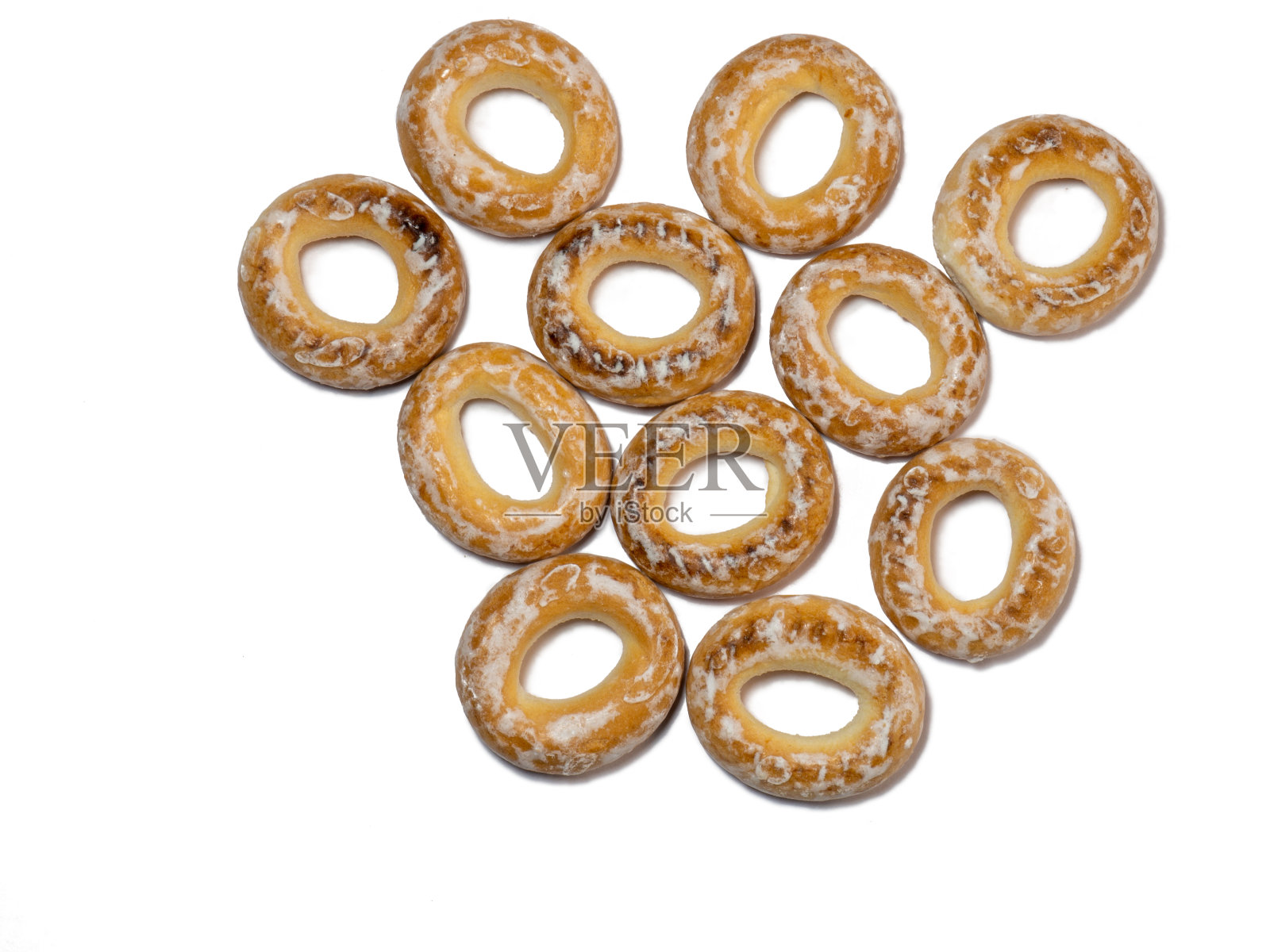 从釉料干燥器中分离出来。在白色背景上放一把百吉饼。照片摄影图片