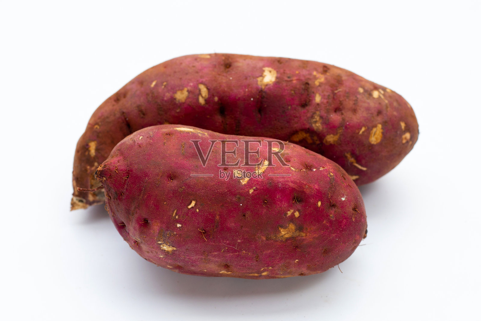 白底红薯。照片摄影图片