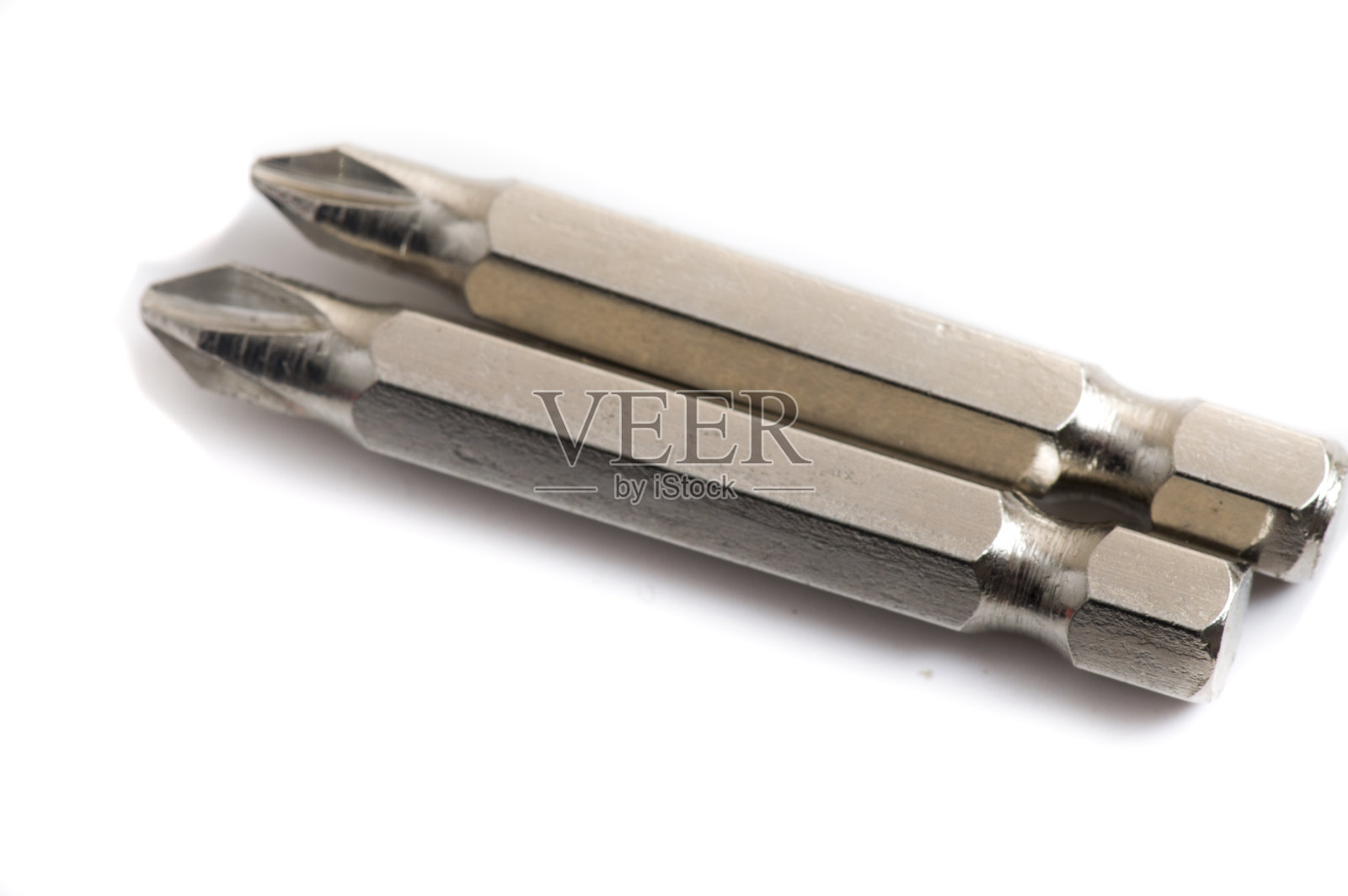 专业施工工具金属开槽钻头喷嘴电动螺丝刀隔离在白色背景照片摄影图片