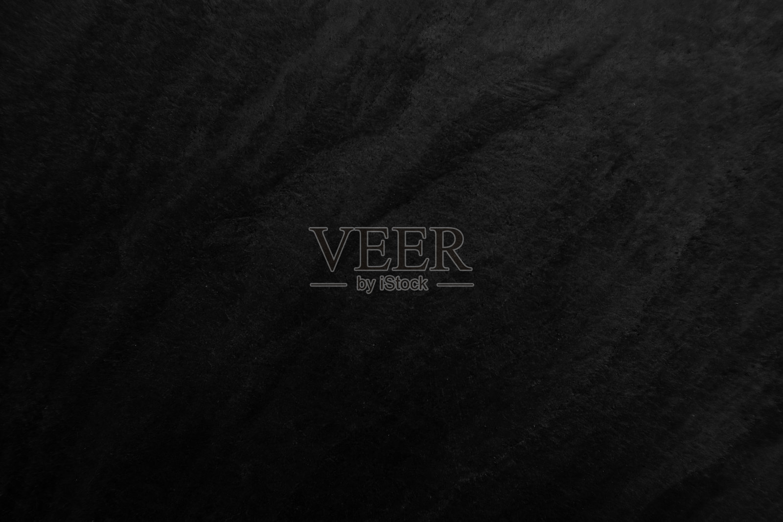 表面黑色石材纹理粗糙梯度叠加，灰黑色调。使用这个墙纸或背景图像。有一个空白的文本空间。“t照片摄影图片