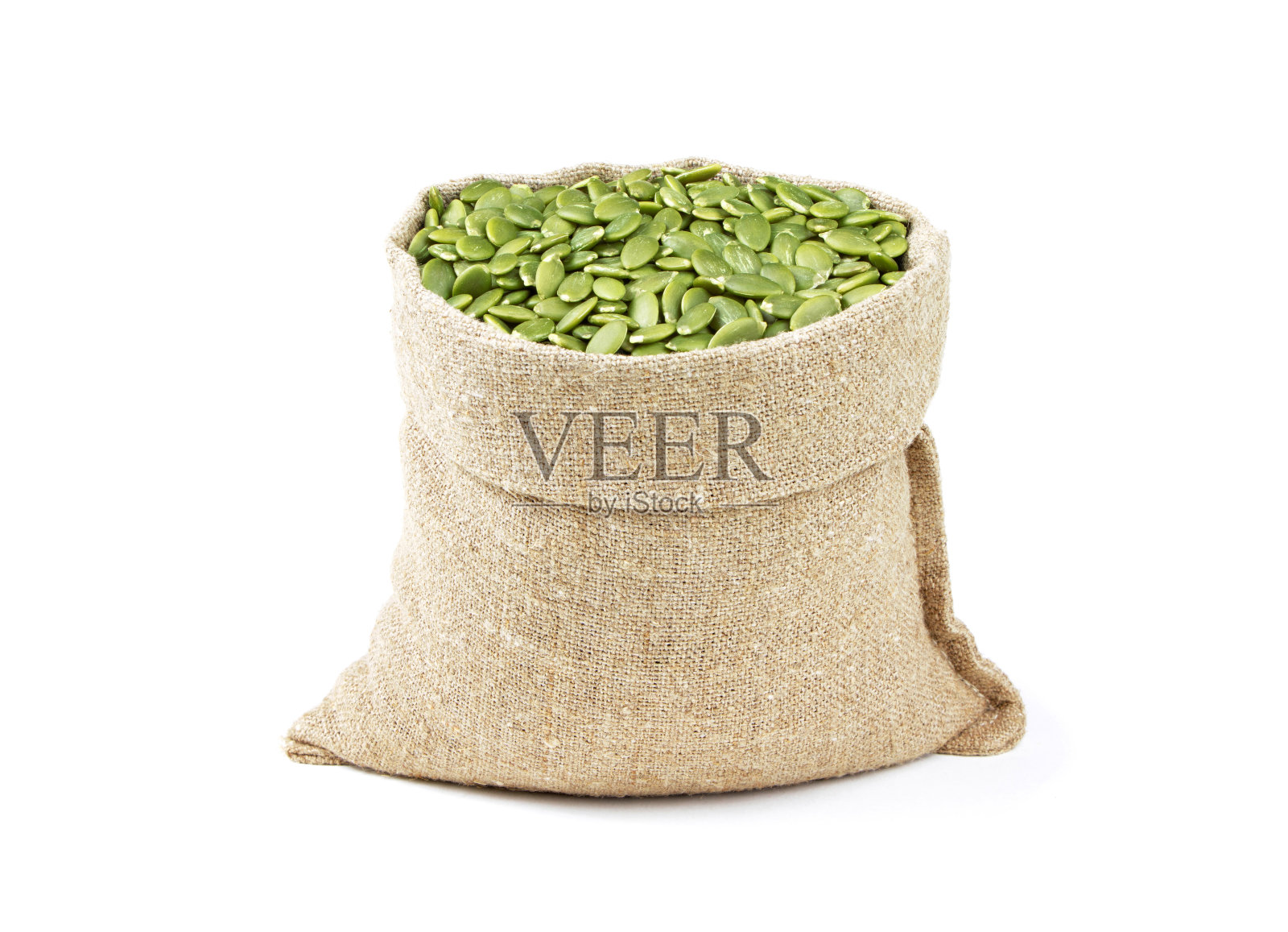 袋装南瓜籽，孤立在白色背景上。麻袋南瓜子。麻袋南瓜子。健康的食物照片摄影图片