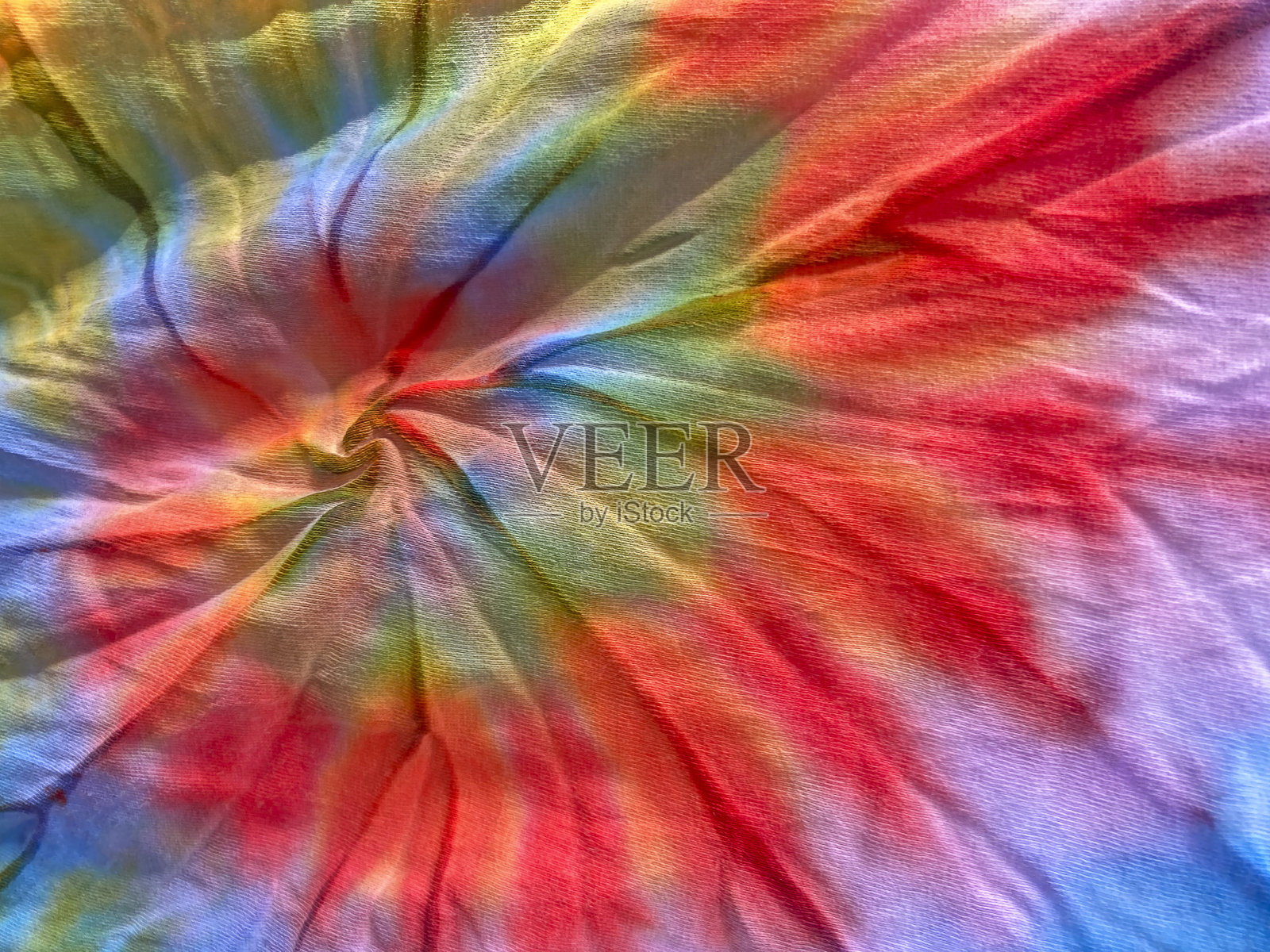 扎染。织物的艺术染色。照片摄影图片