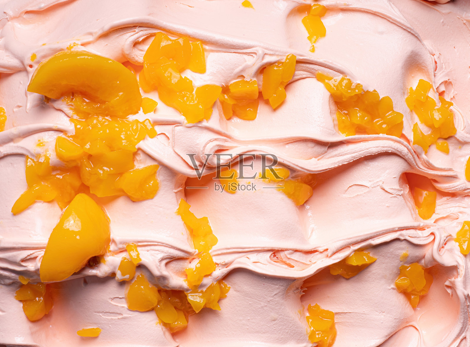 冰冻桃子口味冰淇淋-完整的框架细节。关闭了。照片摄影图片