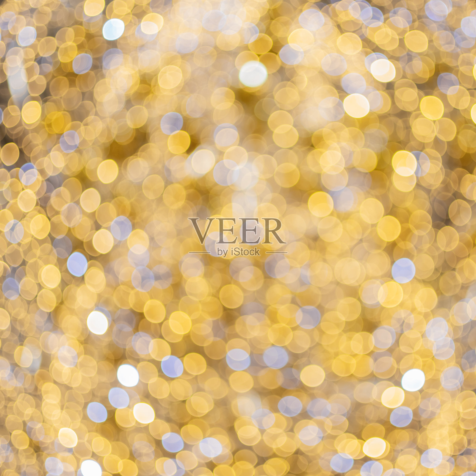 背景与散景图案在金色的色调。光学散焦效应。节日的图片照片摄影图片