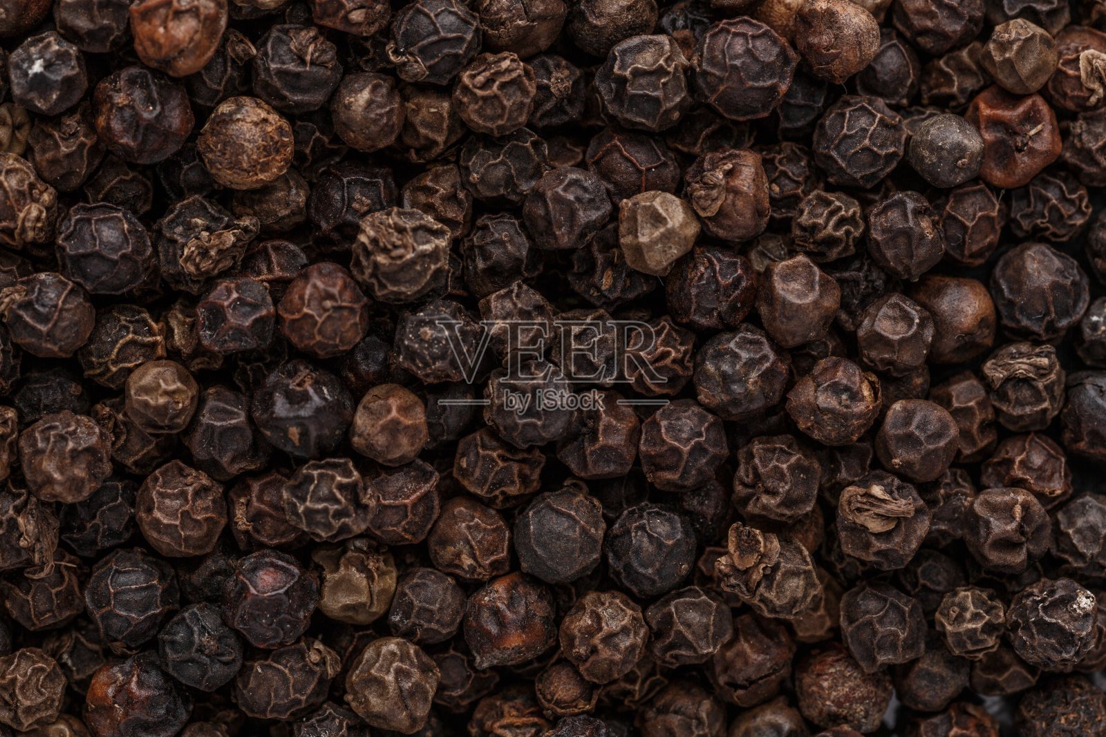 胡椒的背景。干黑胡椒种子。前视图。平面设计。宏香料背景照片摄影图片