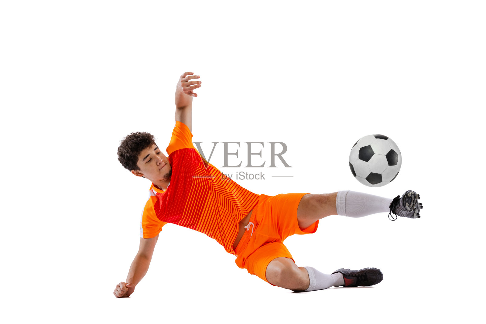 职业足球，足球运动员在运动孤立在白色演播室背景。运动的概念，比赛，积极的生活方式，目标和爱好照片摄影图片
