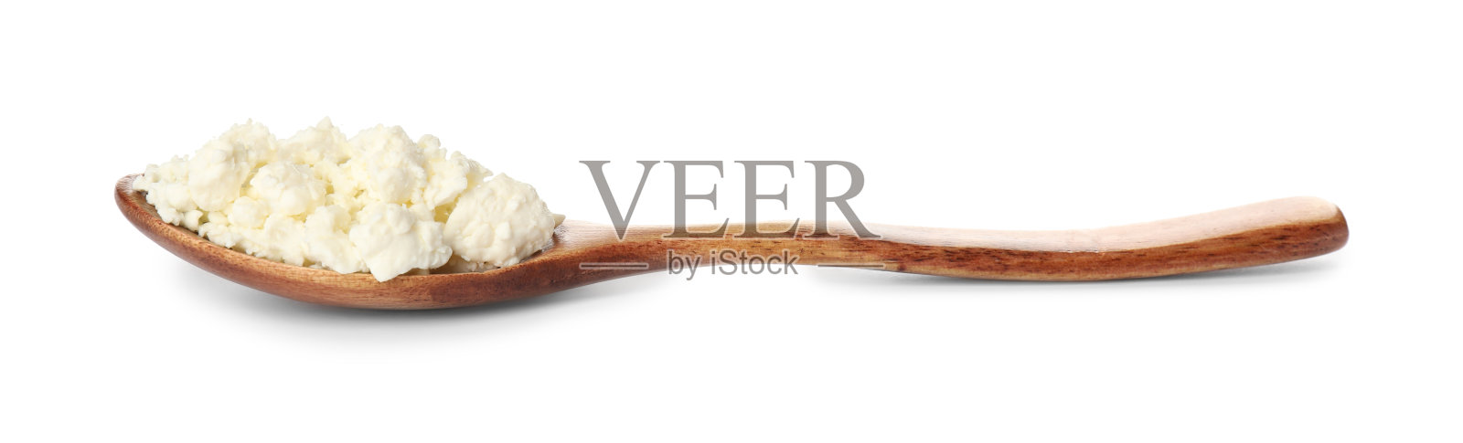 美味新鲜的白软干酪在勺子上孤立照片摄影图片