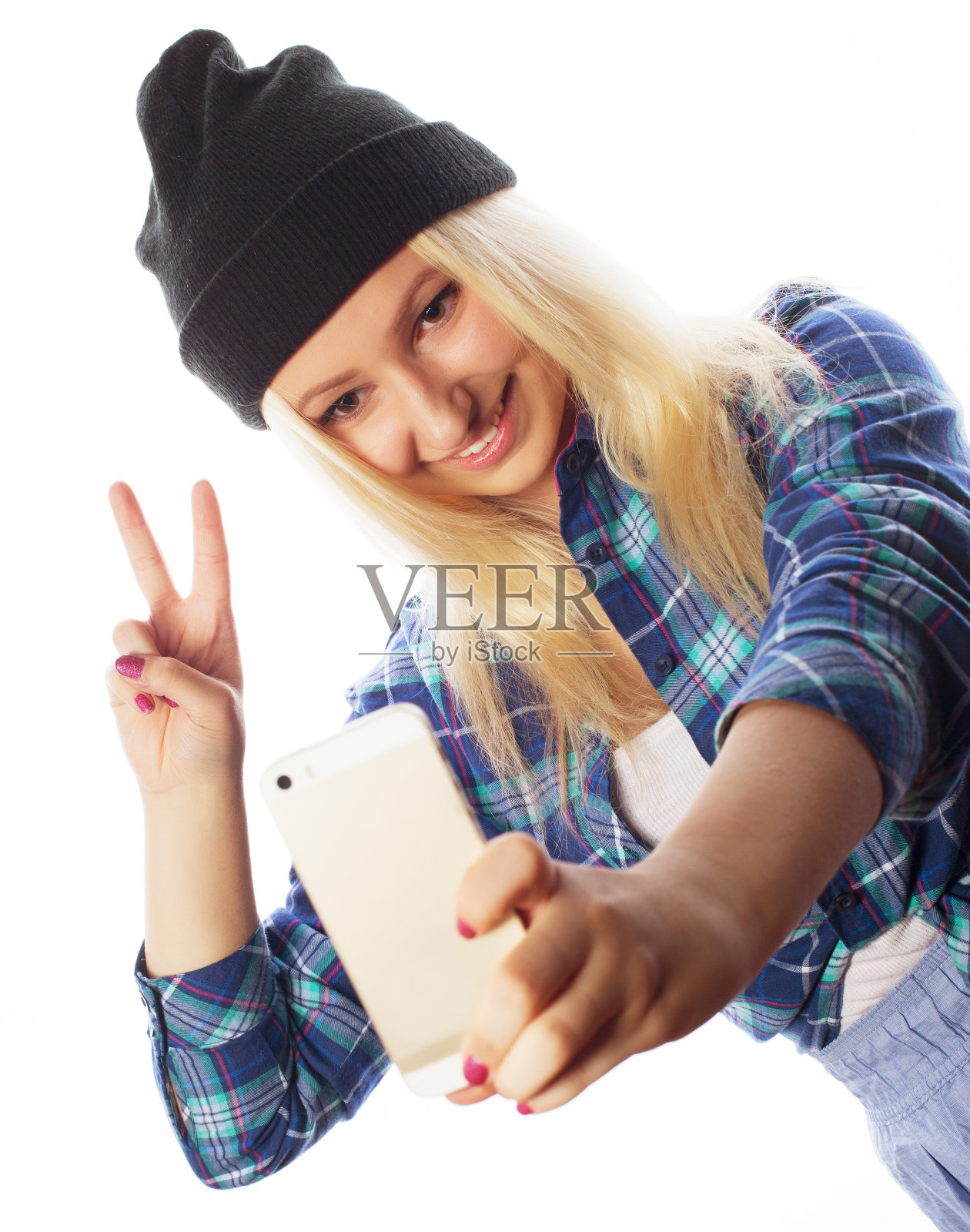 戴着帽子的漂亮少女在自拍照片摄影图片