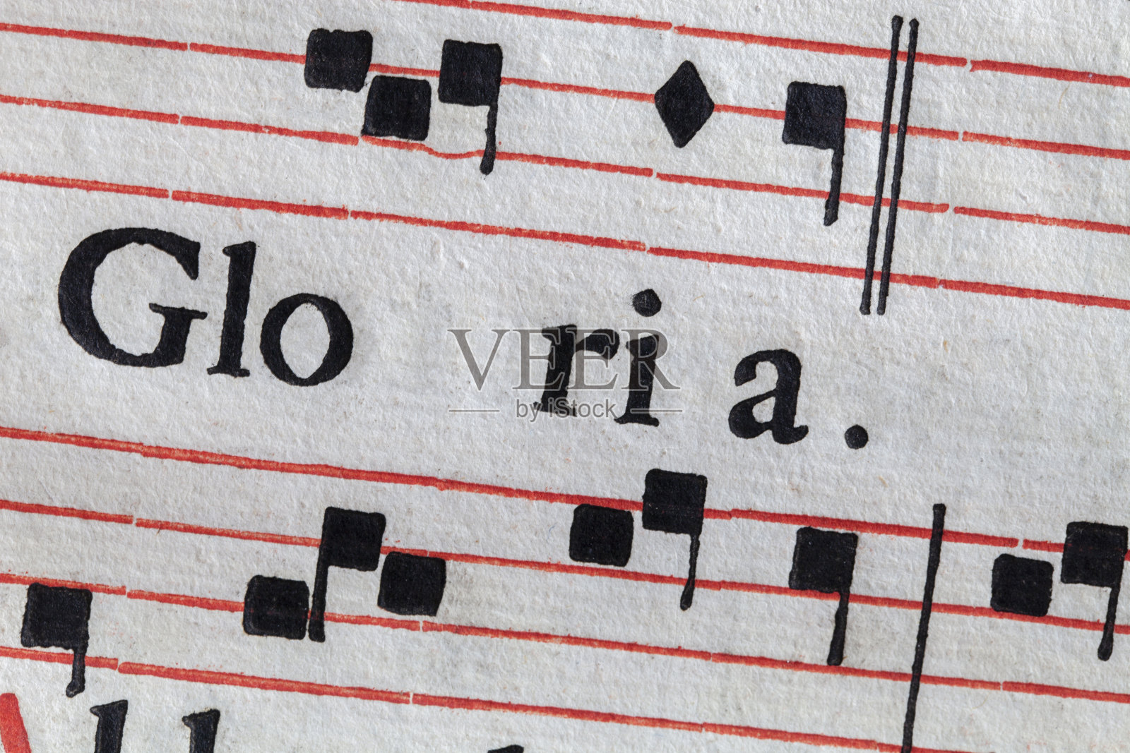 格洛丽亚。古董乐谱。拉丁赞美诗的羊皮纸。照片摄影图片