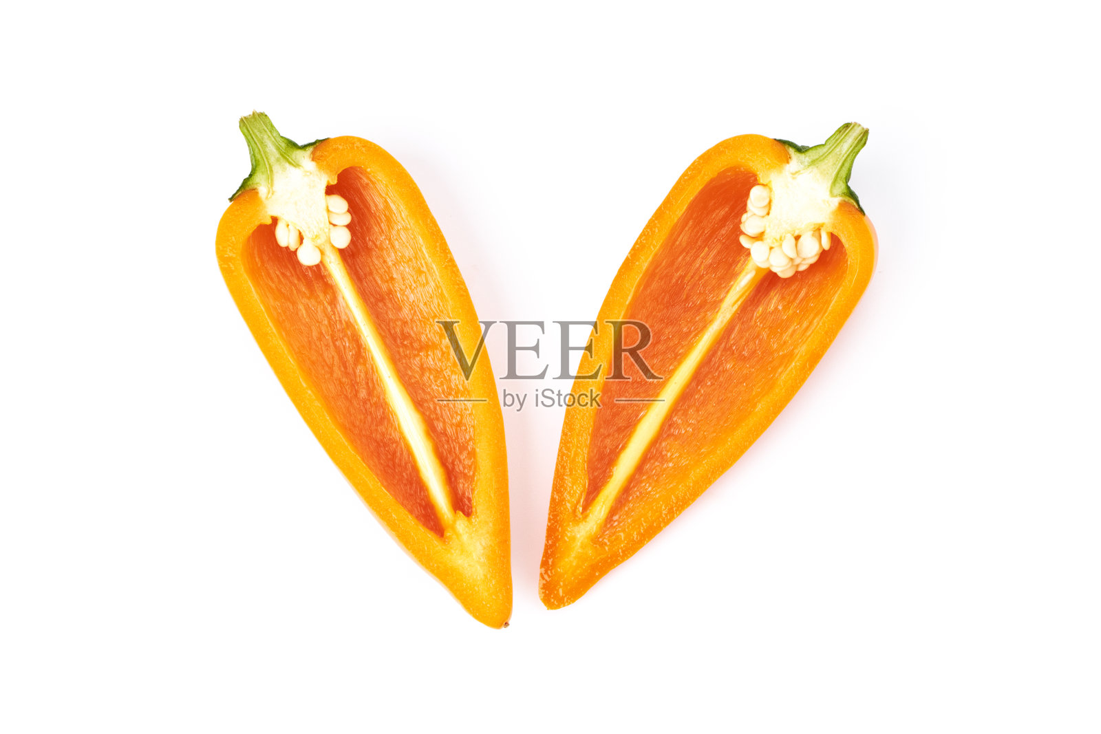 美味的迷你橙甜椒切成两半。美味的蔬菜照片摄影图片