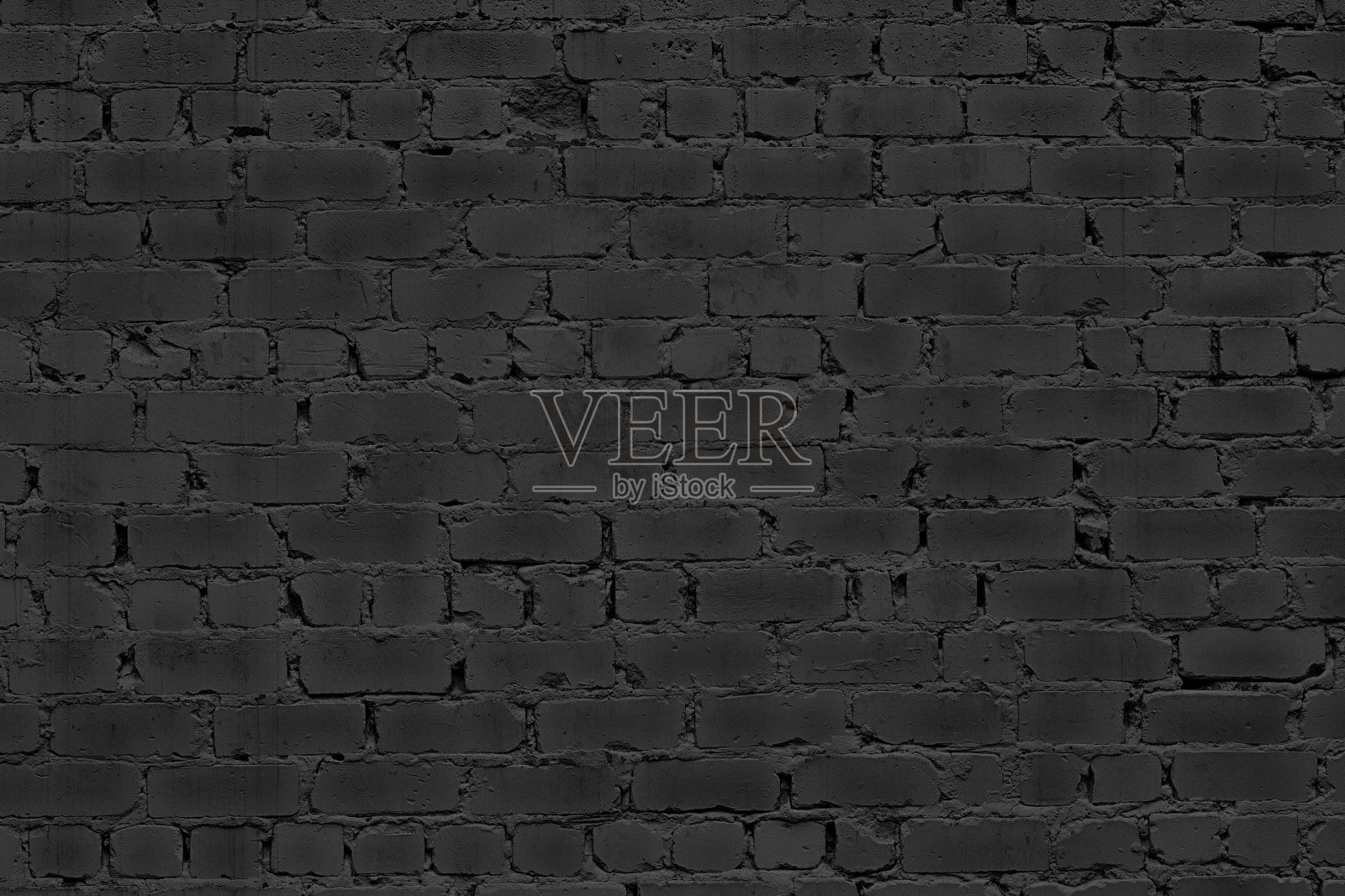 老旧粗糙的黑砖墙纹理。陈旧的黑色砖石结构。抽象阴郁的垃圾摇滚质感背景照片摄影图片