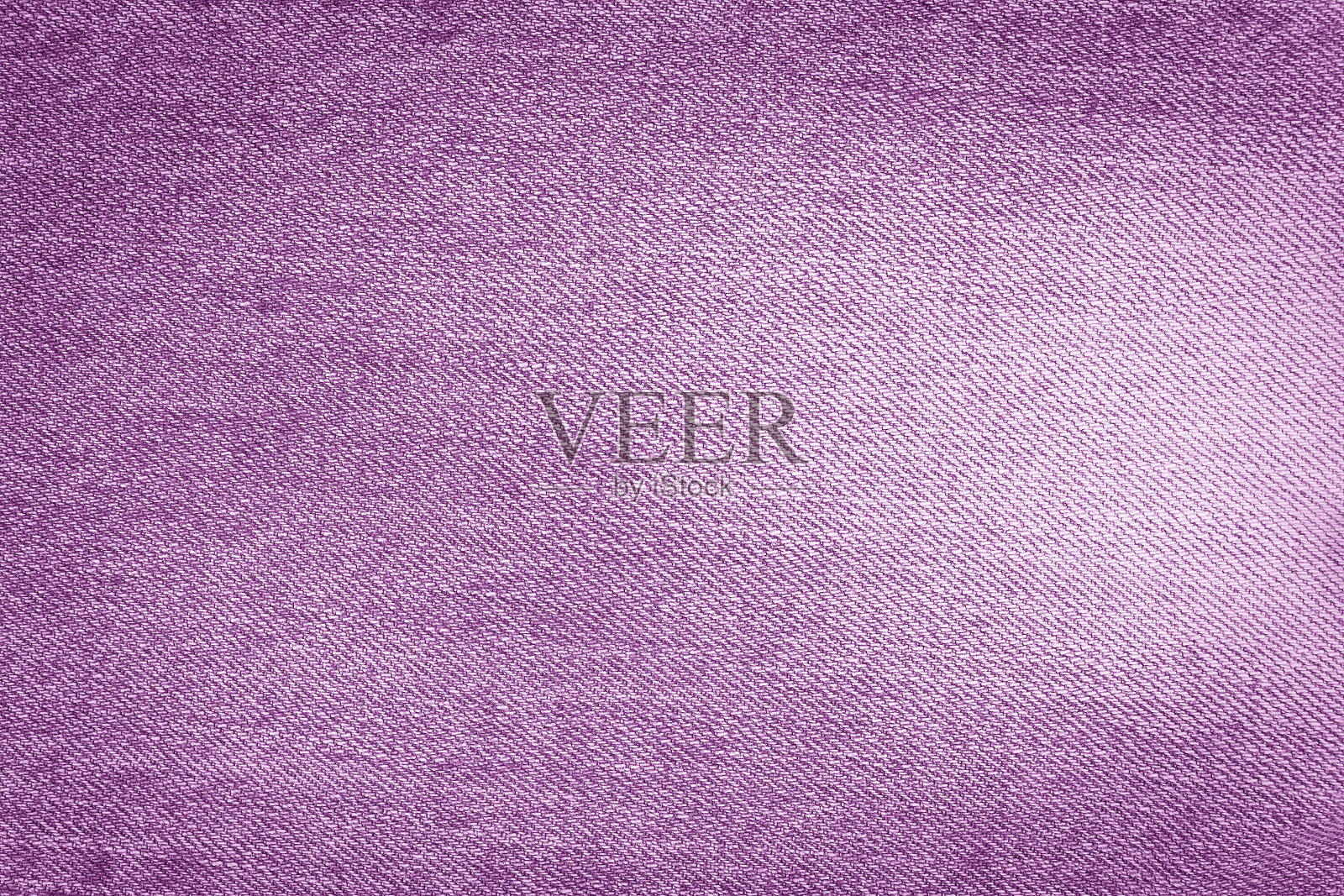 牛仔裤质地为紫色。紫色的背景照片摄影图片