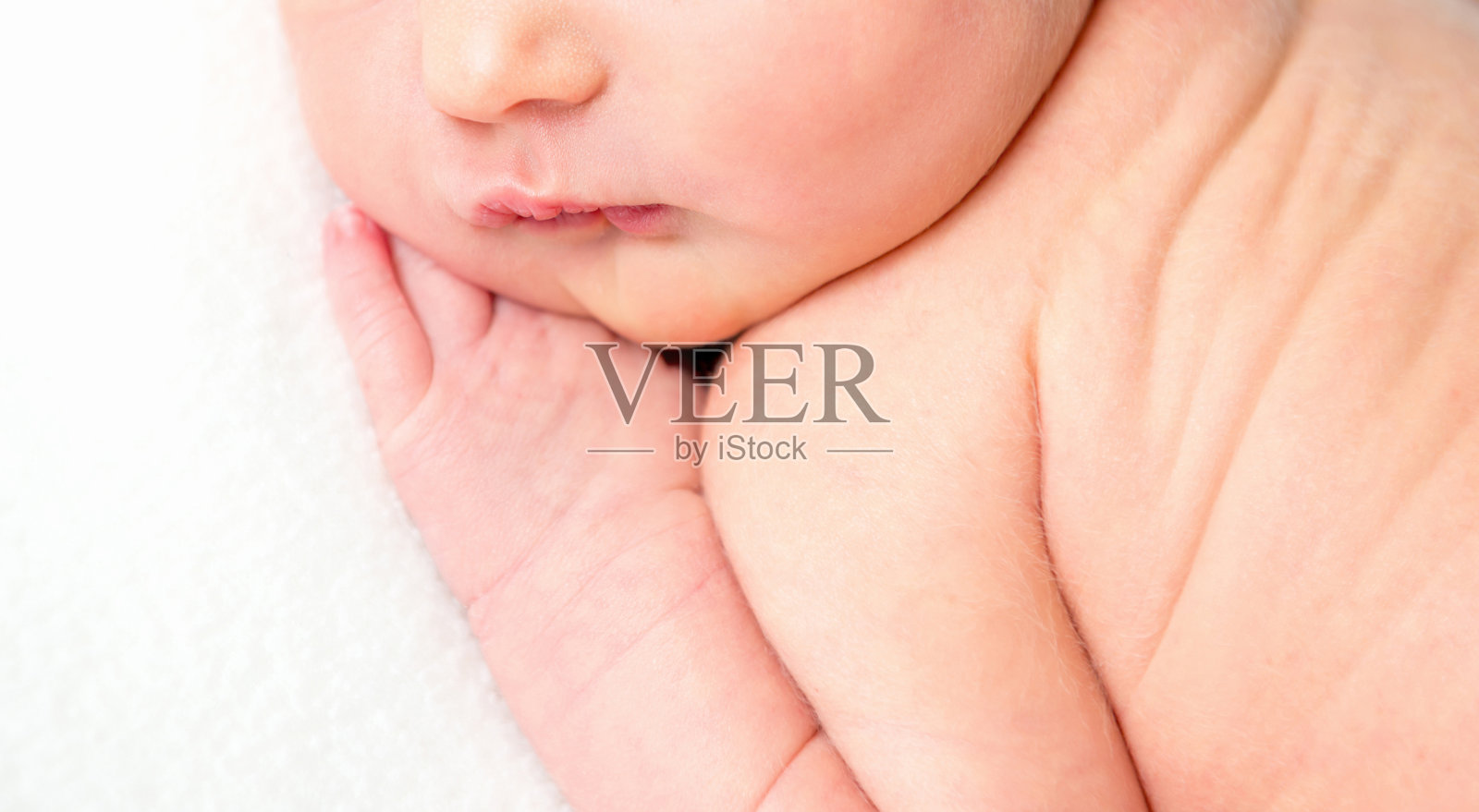 新生儿脸的特写肖像照片摄影图片