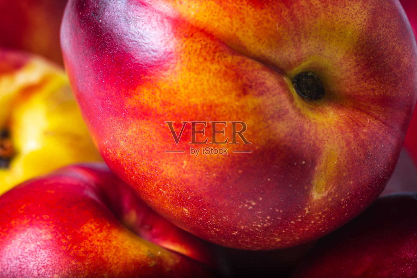 成熟油桃水果的背景特写照片摄影图片