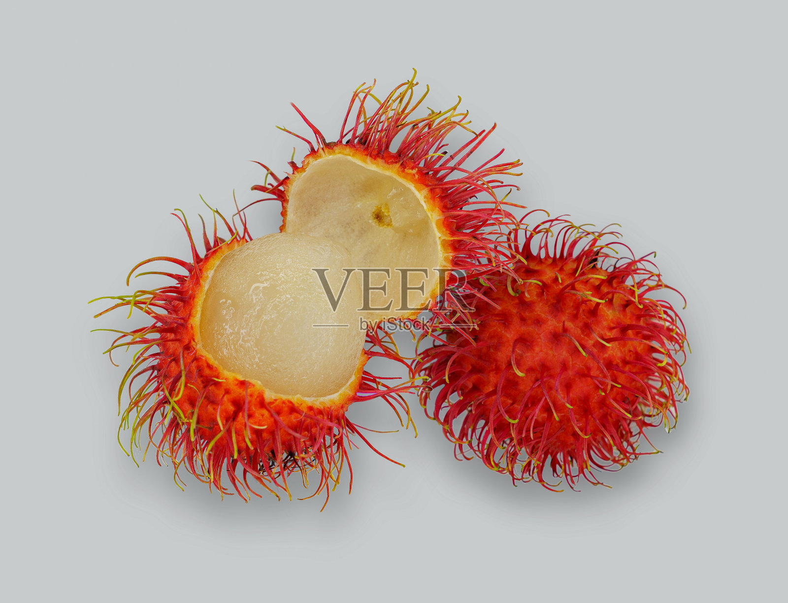 白底红毛丹。照片摄影图片