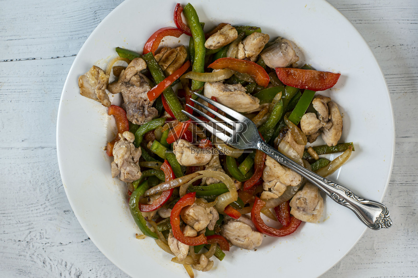 炒辣椒、洋葱和鸡肉照片摄影图片