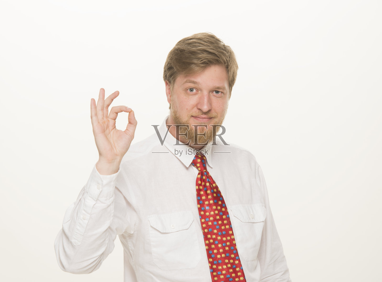 一个年轻的商人的肖像，教师，经理，专业的男人在一个白色的背景上孤立照片摄影图片