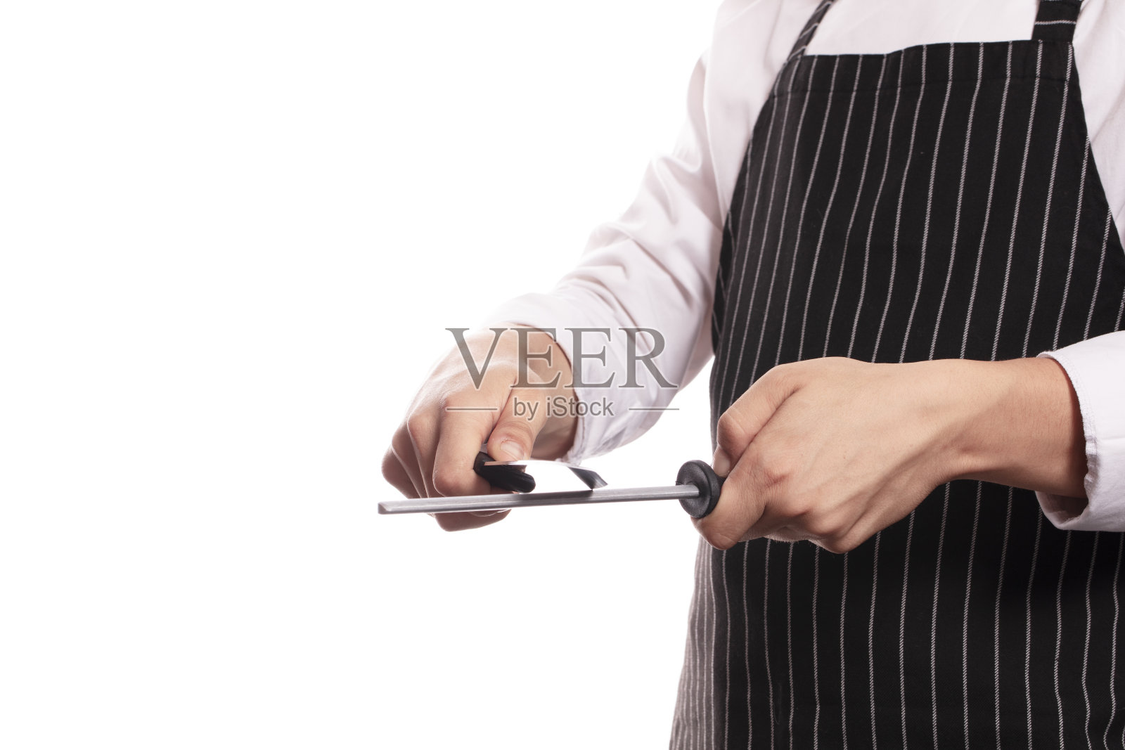 面目全非的厨师在磨刀照片摄影图片