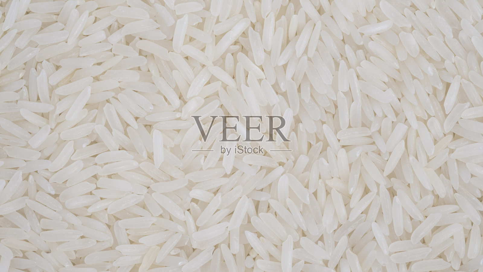 有机白色生茉莉香米底色，白色长种子。宏观的特写镜头。作为图片背景或背景图案的纹理照片摄影图片