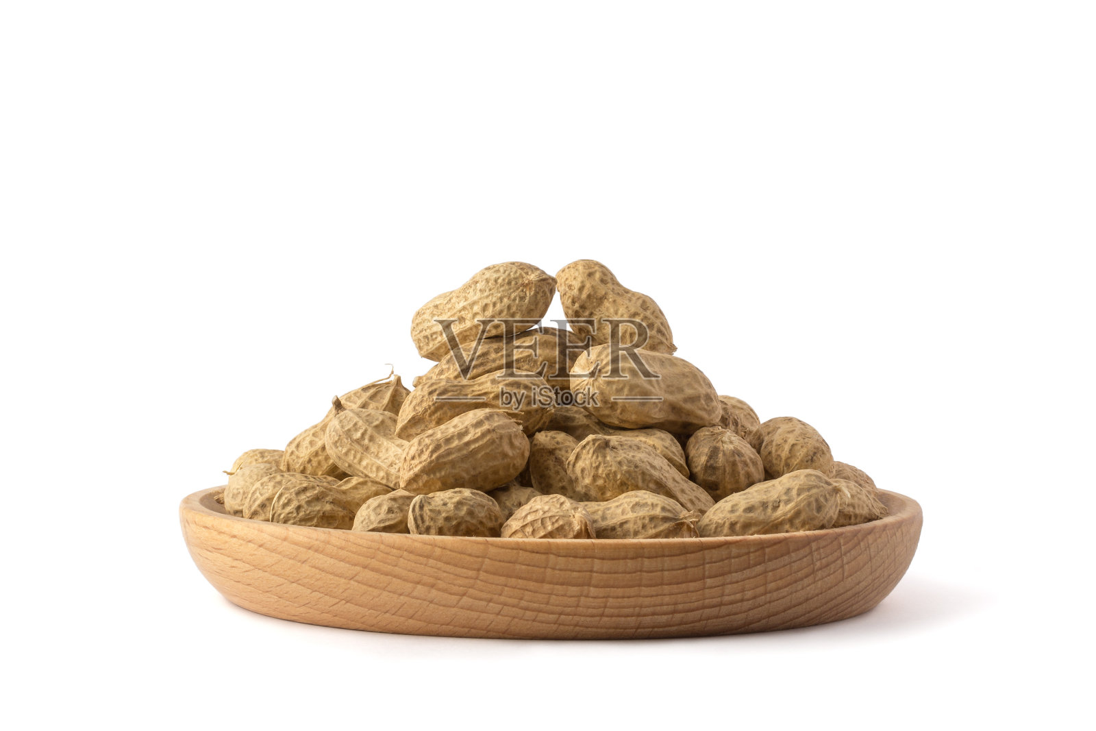 未剥皮的花生放在托盘里照片摄影图片