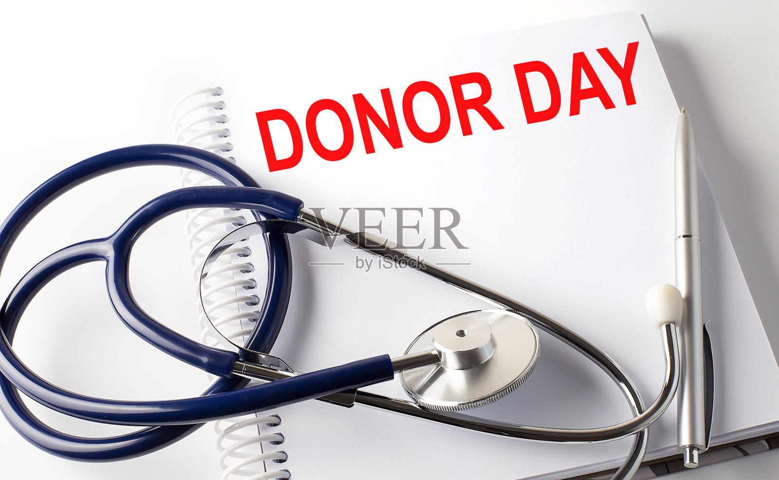 笔记本与文字捐赠日与笔和听诊器照片摄影图片