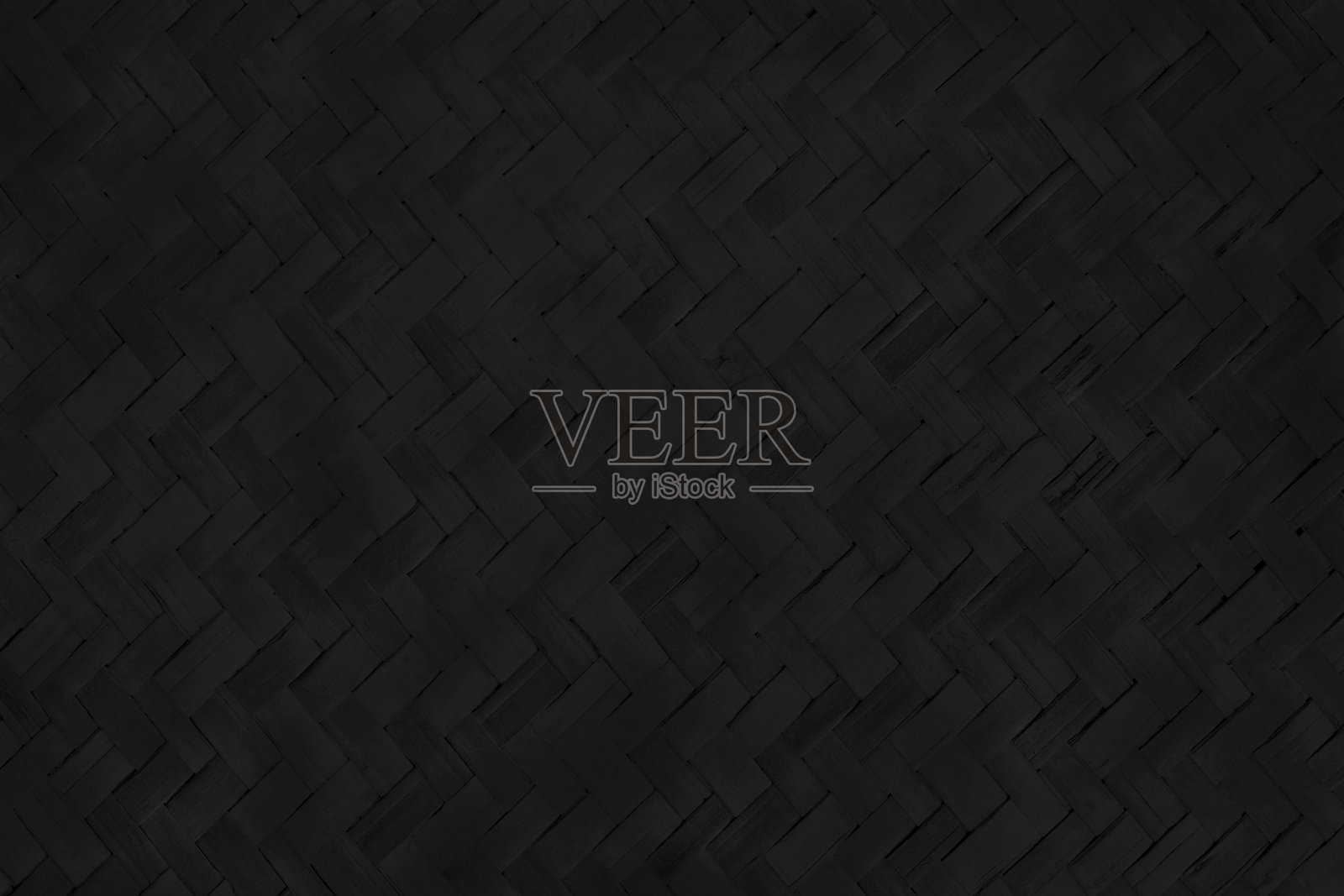 古老的黑色竹编纹理背景，复古风格的编织藤席图案。照片摄影图片