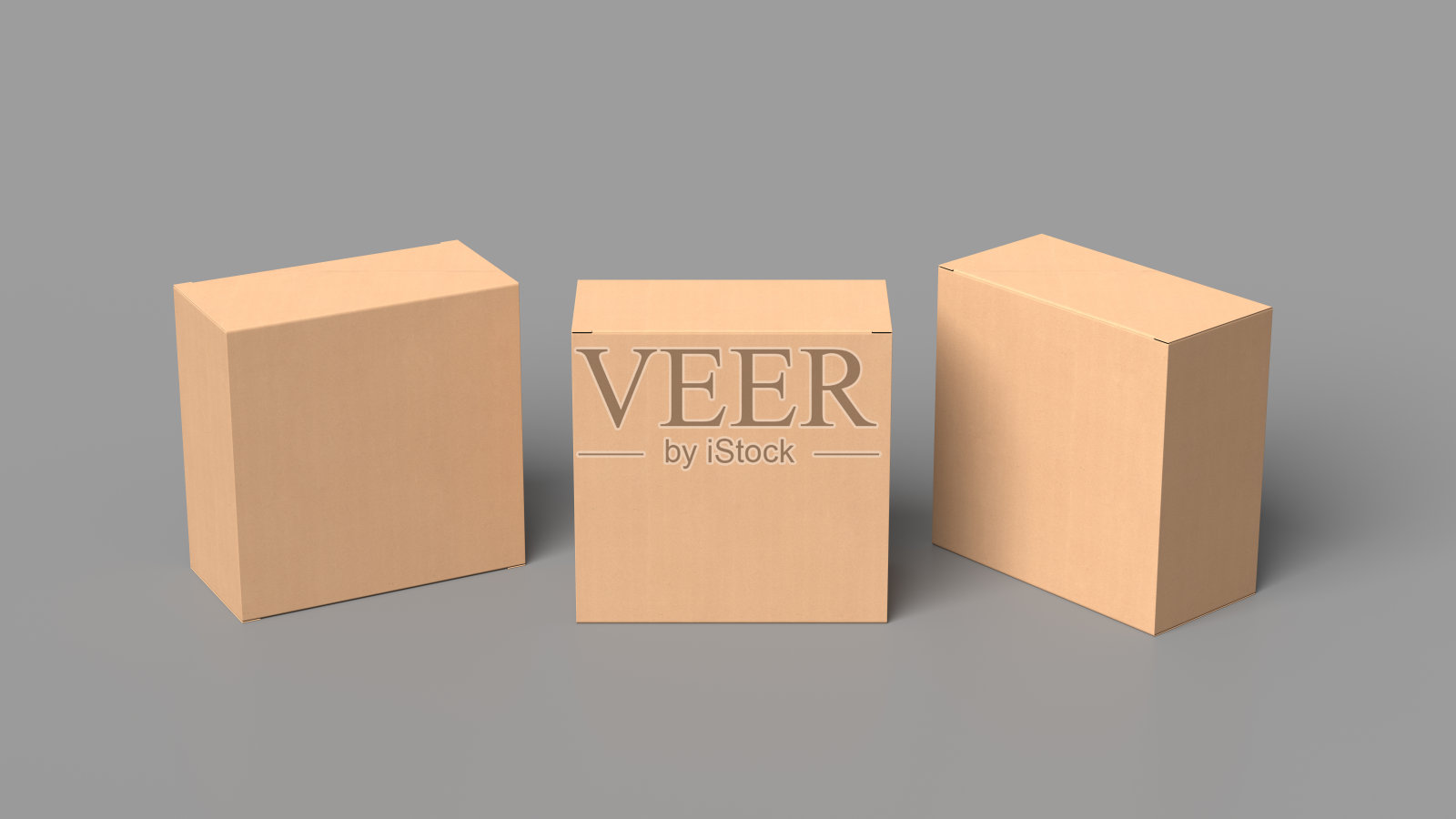 三个方盒做模型。灰色背景的硬纸盒照片摄影图片