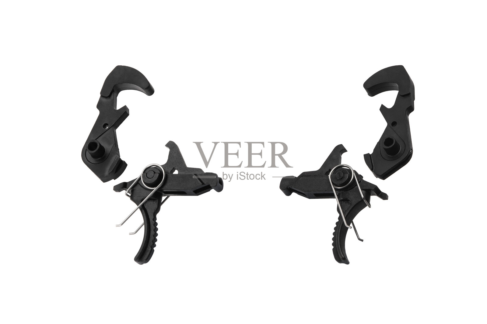 白色背景上隔离枪的电击扳机。枪扳机。维修备件。照片摄影图片