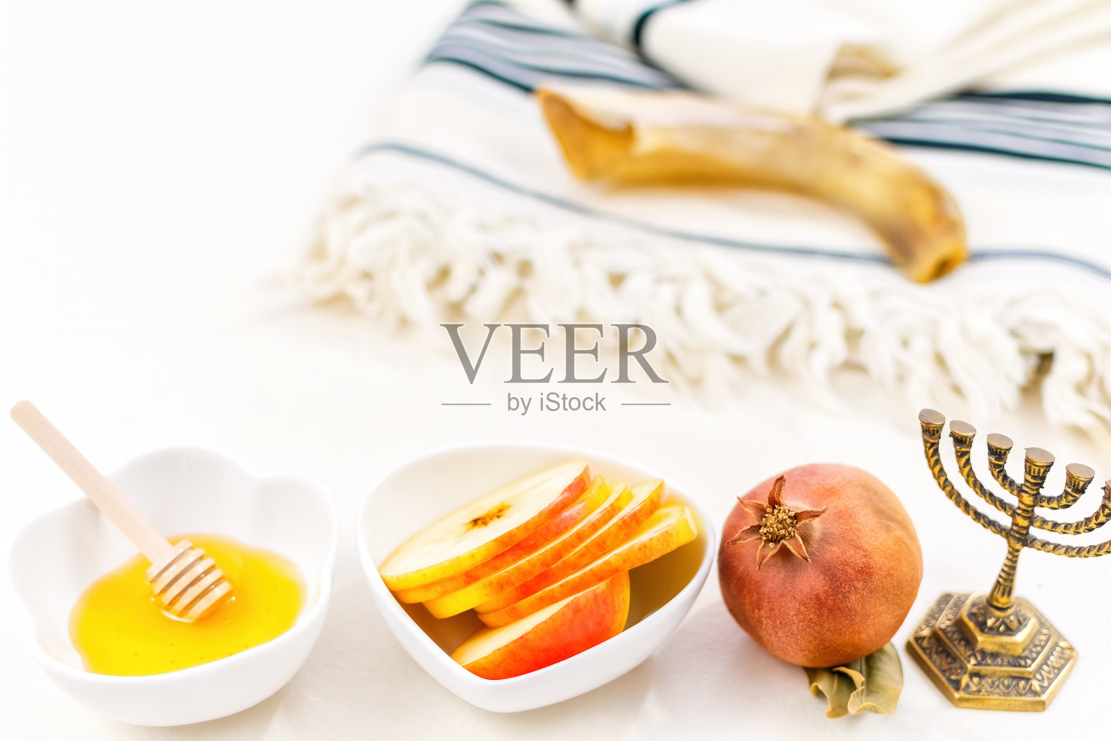 犹太新年节日庆祝概念：蜂蜜和苹果照片摄影图片