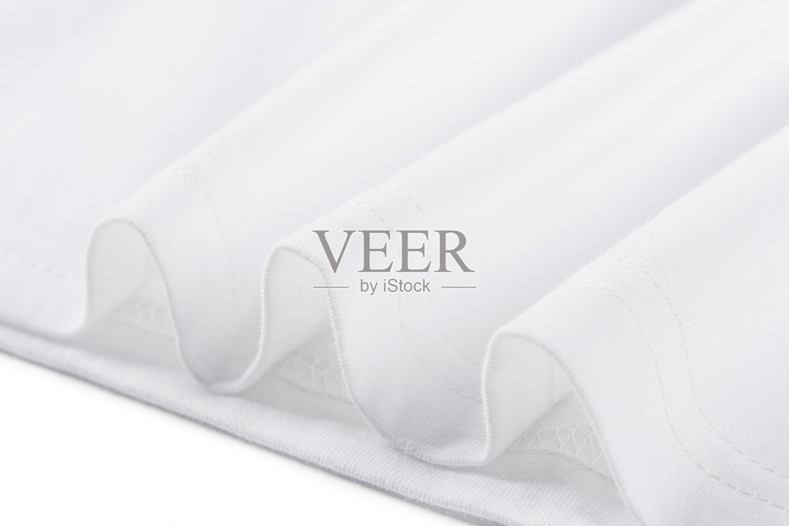 白色纯棉面料纹理背景。布料和棉花的折痕。照片摄影图片