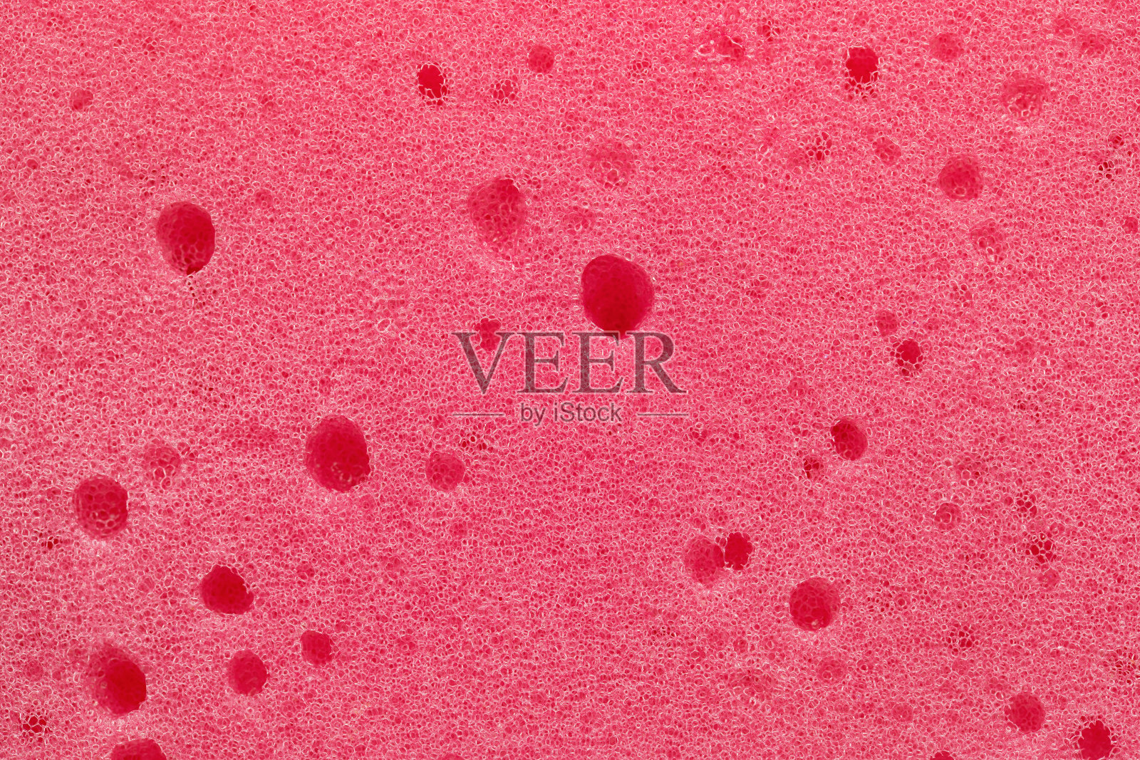 背景，照片的粉红色泡沫橡胶质地，特写。照片摄影图片