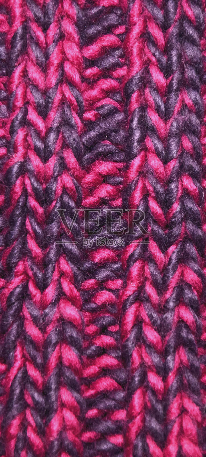 特写针织质地洋红色调色板。冬季质感概念，针织服装。照片摄影图片