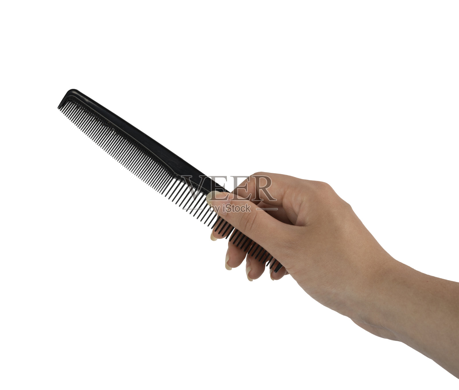 女人手里拿着一把梳子照片摄影图片