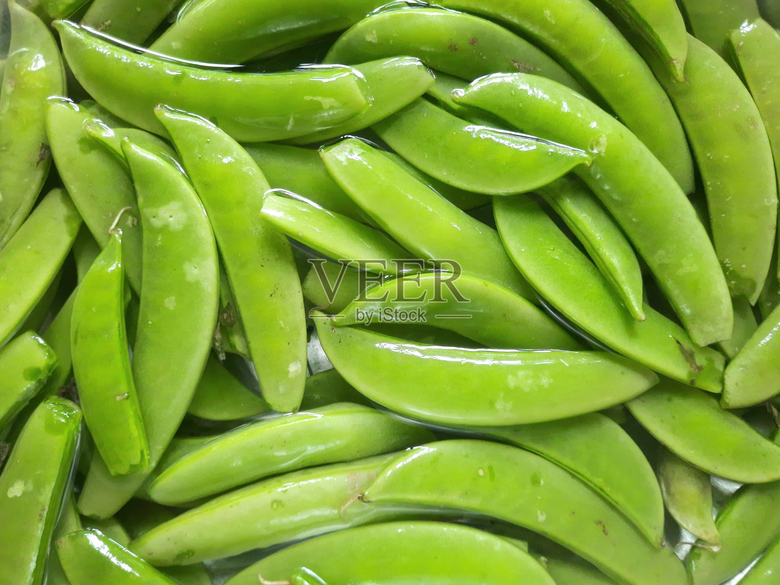 封闭绿豌豆-食物准备。照片摄影图片