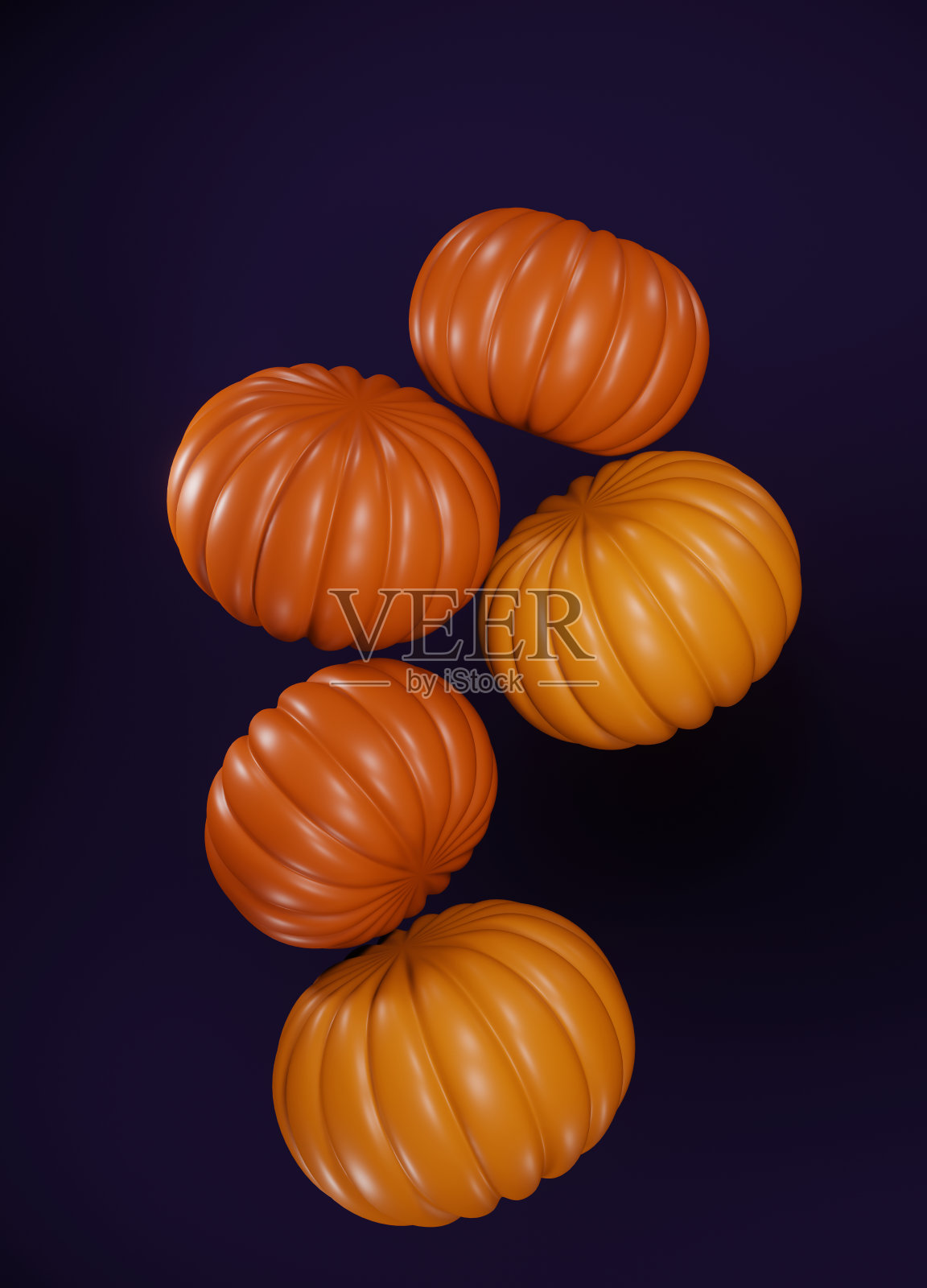 一组悬浮在紫色背景上的南瓜照片摄影图片
