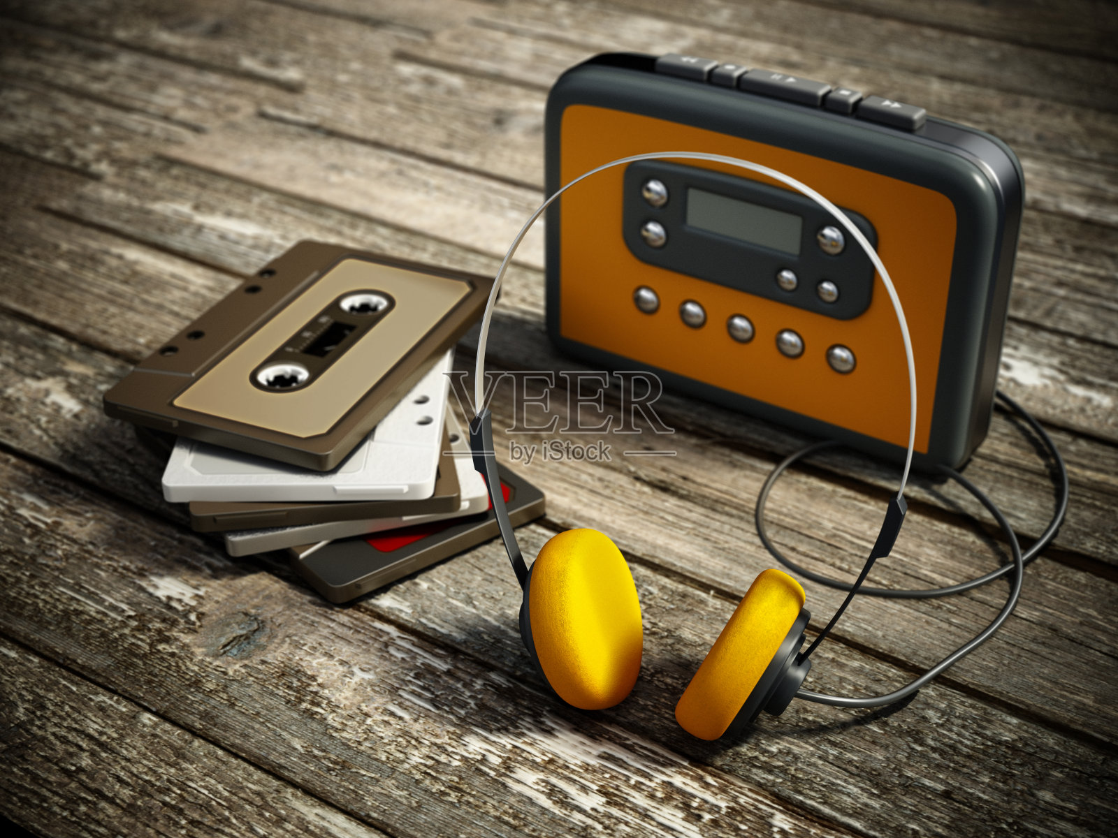 老式个人音频卡带播放机与黄色耳机和模拟音频卡带照片摄影图片
