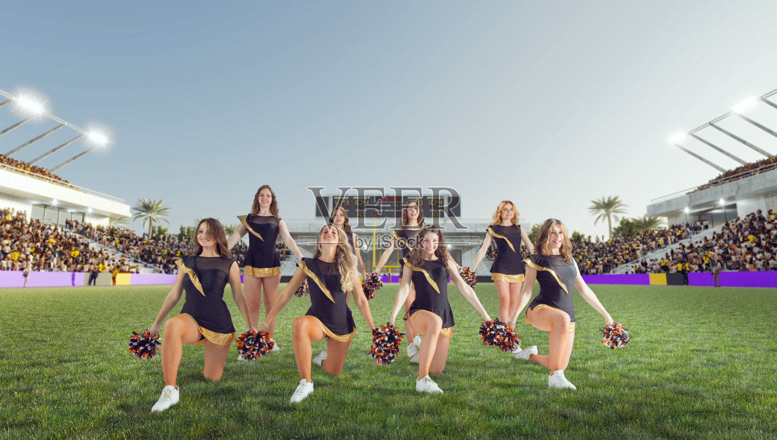 一群在体育场活动的拉拉队员照片摄影图片