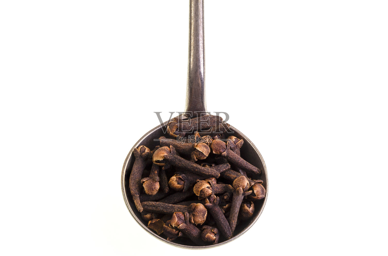 干丁香放在勺子上照片摄影图片