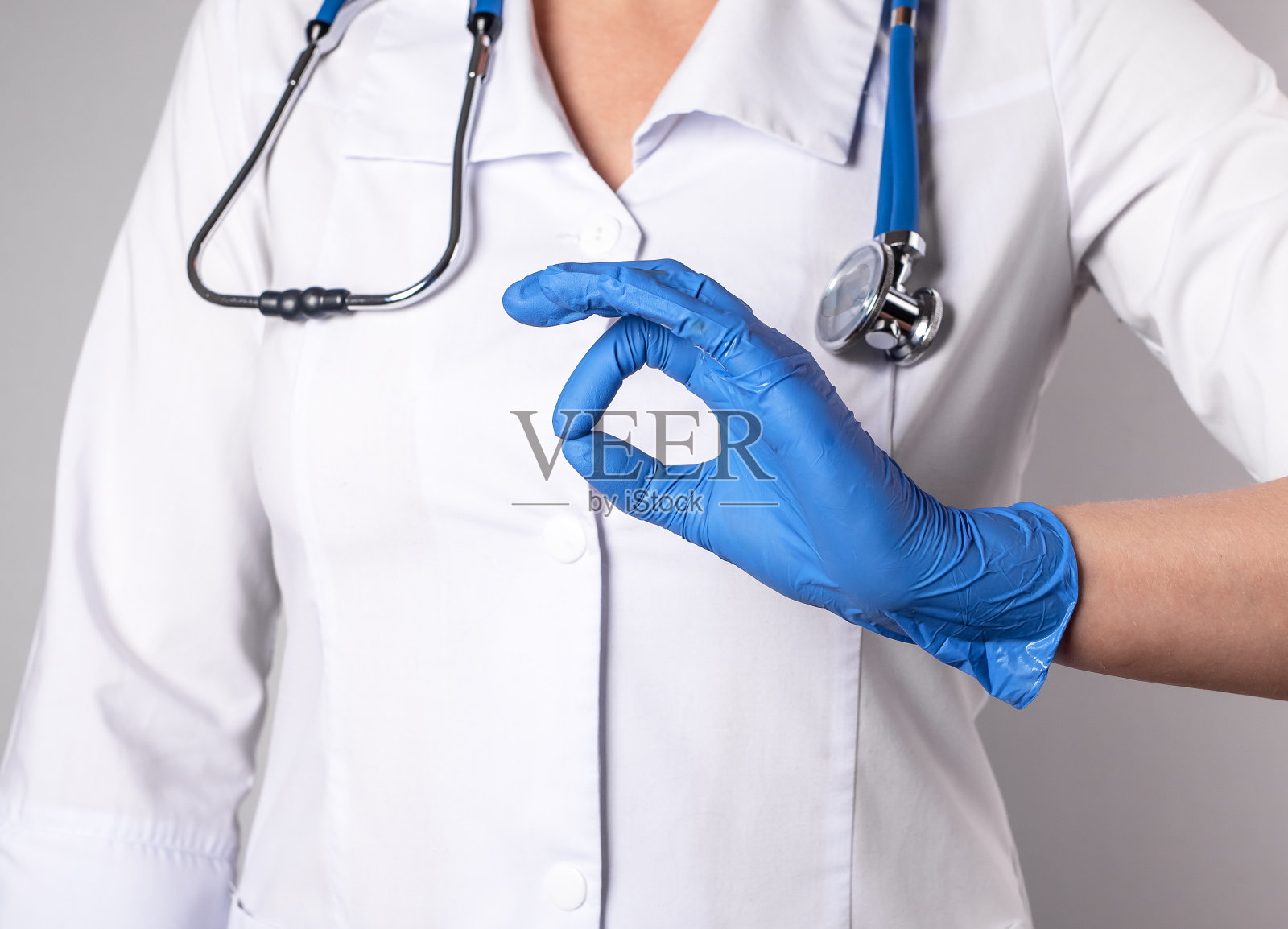 医生手戴手套的手势照片摄影图片