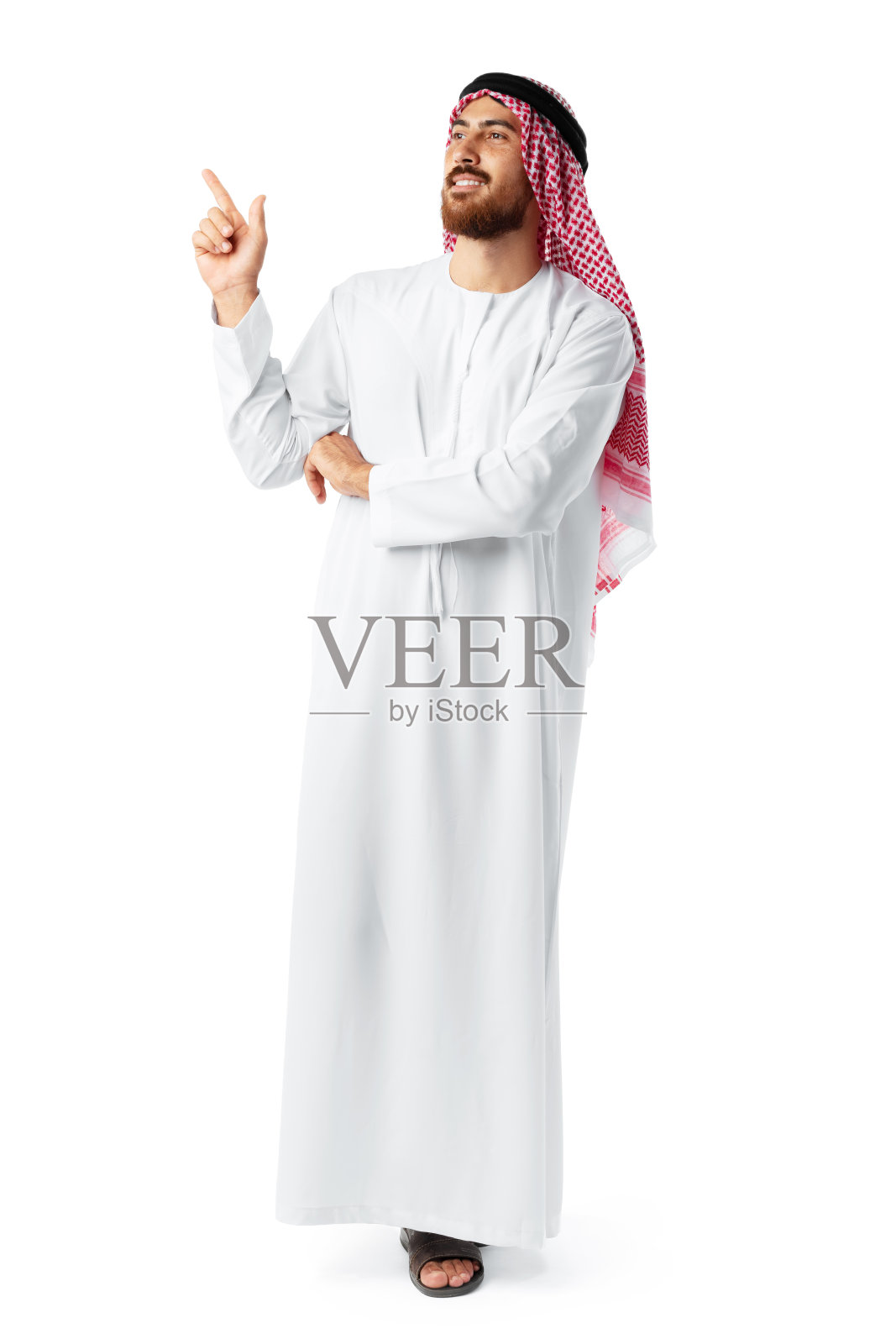 年轻的阿拉伯人指着白色背景上孤立的手照片摄影图片