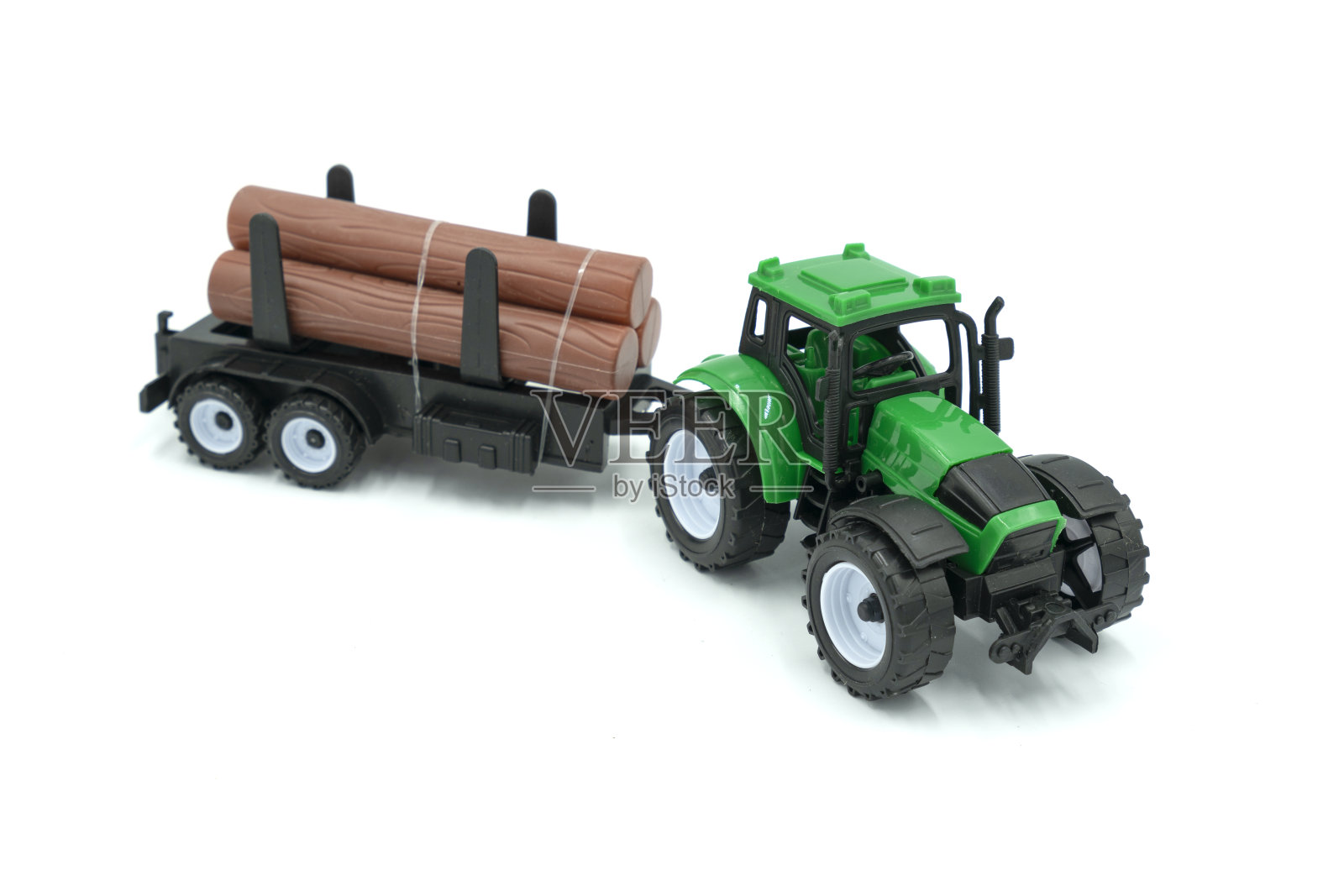 玩具拖拉机孤立在白色背景。照片摄影图片