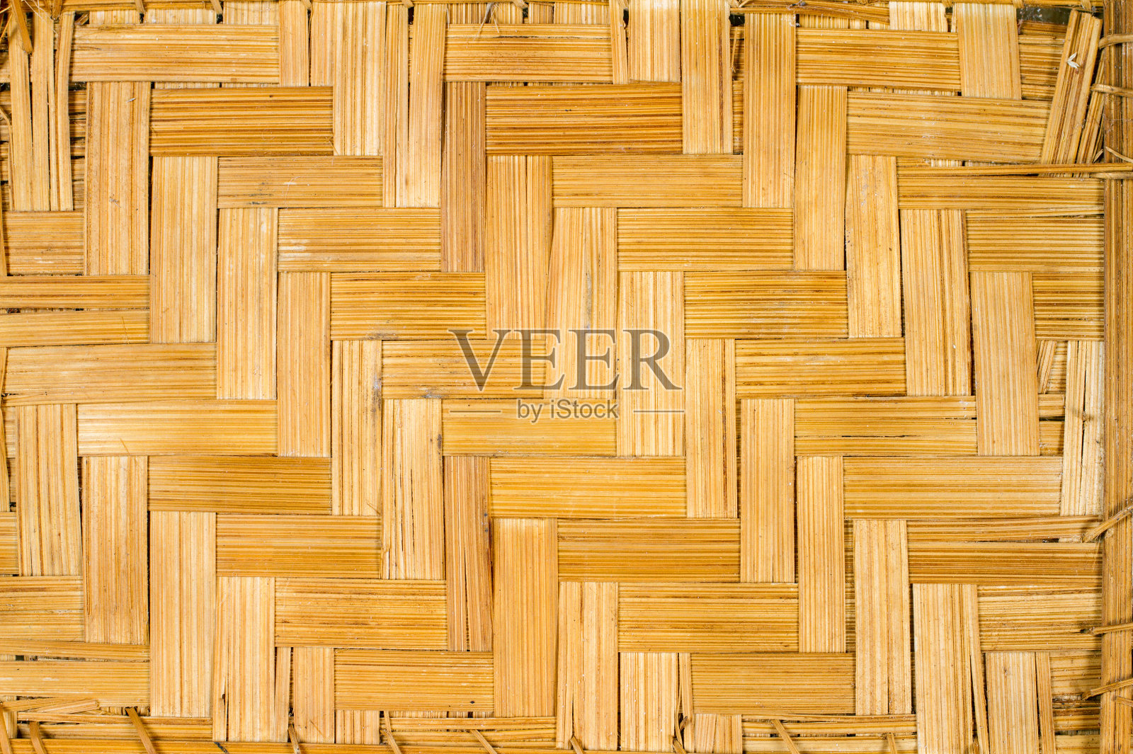 稻草交织的背景纹理。照片摄影图片