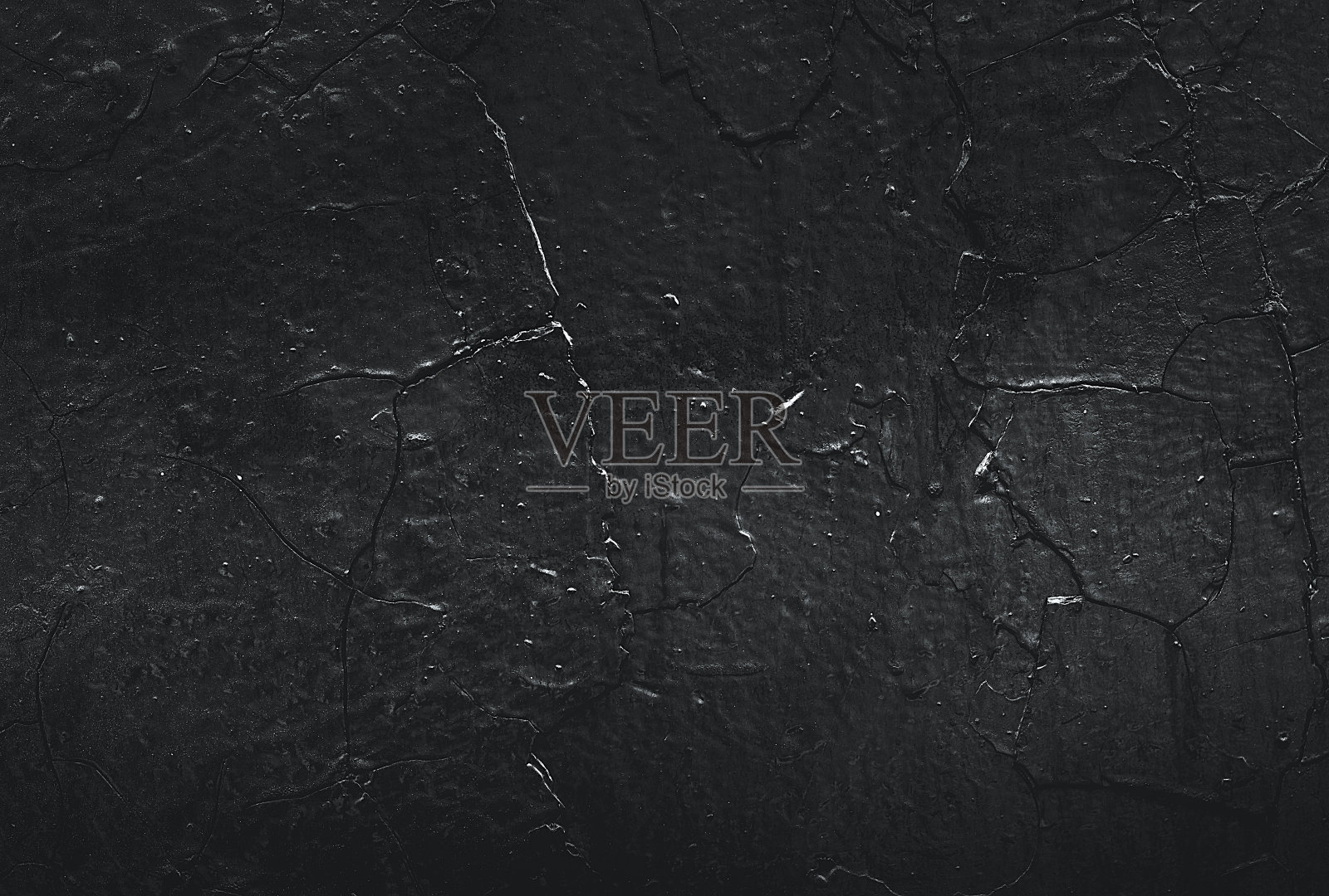 抽象的纹理。墙漆点。黑色的纹理。石头的背景。黑暗的大理石。岩石纹理。岩石表面有裂缝。岩石堆。枯燥乏味的粗糙结构。照片摄影图片