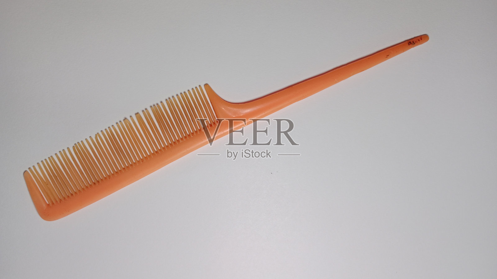 橙色的梳子照片摄影图片