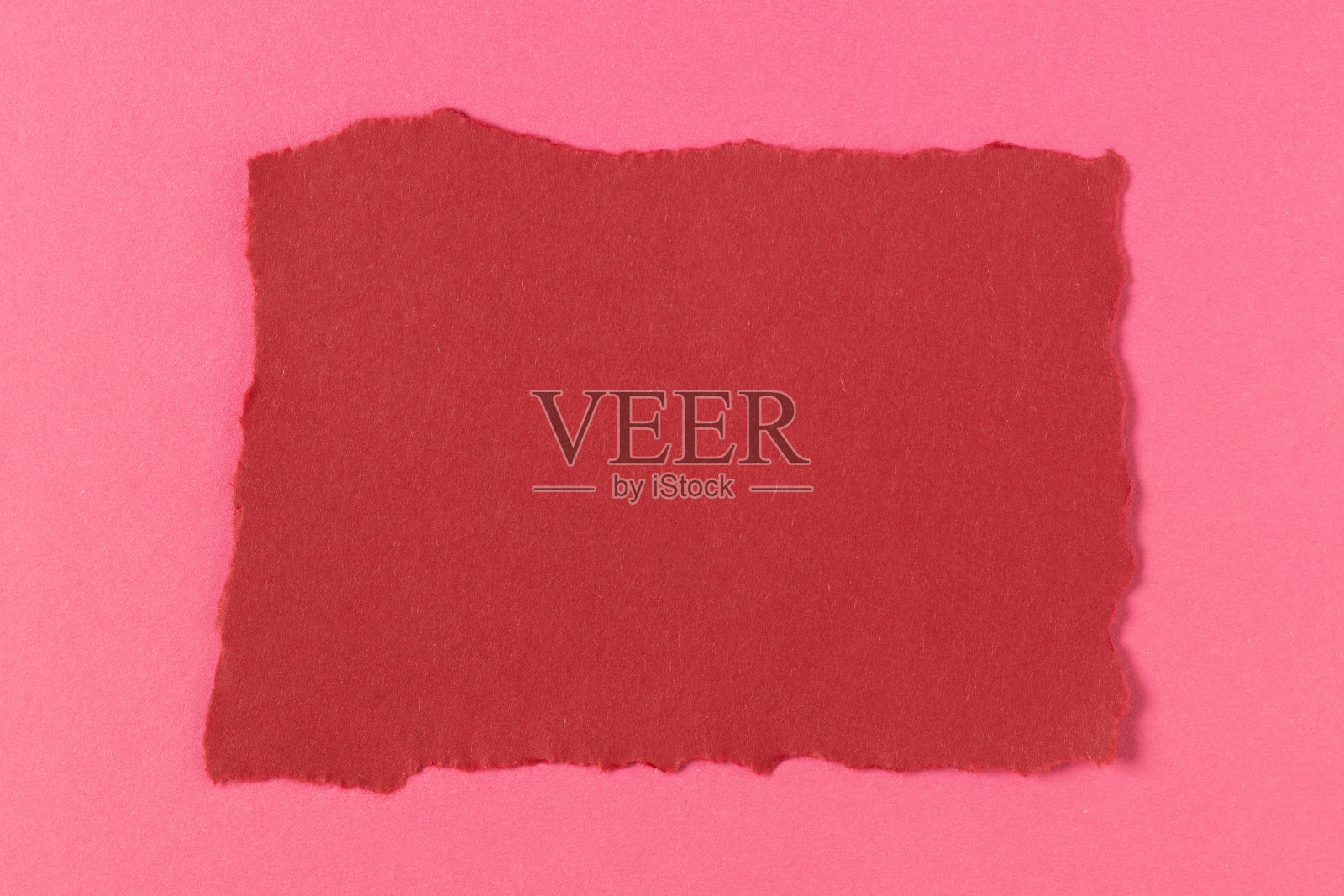 红粉色硬纸板纸背景。照片摄影图片