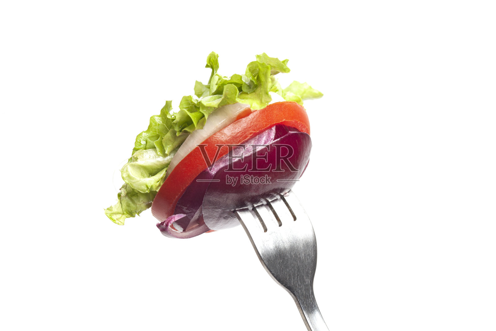 蔬菜放在叉子上，红洋葱，甜椒，生菜，西红柿照片摄影图片