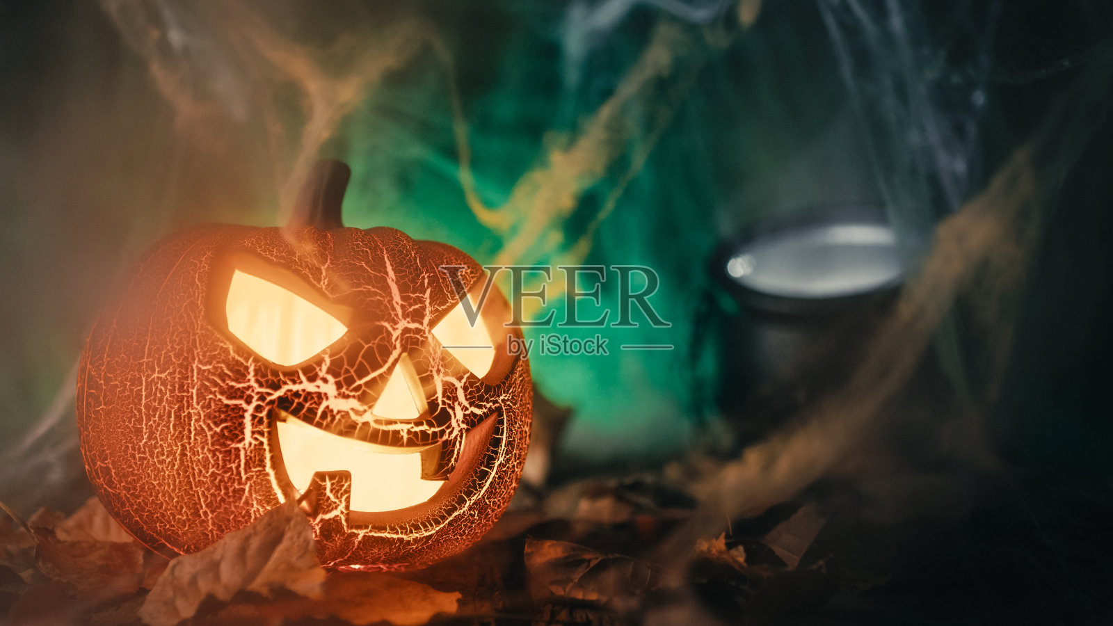 万圣节南瓜，背景是花盆照片摄影图片