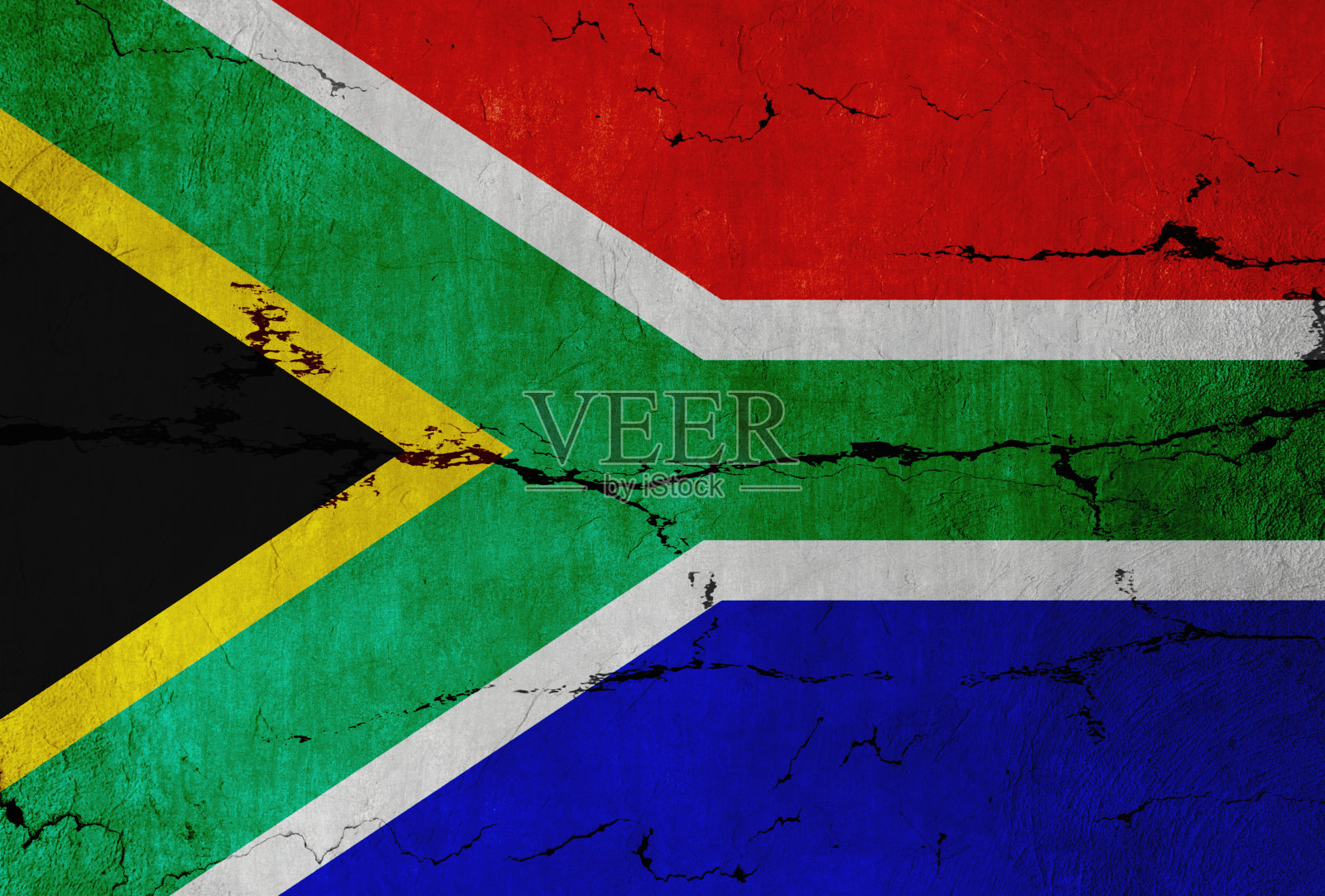 裂缝墙上的南非国旗照片摄影图片